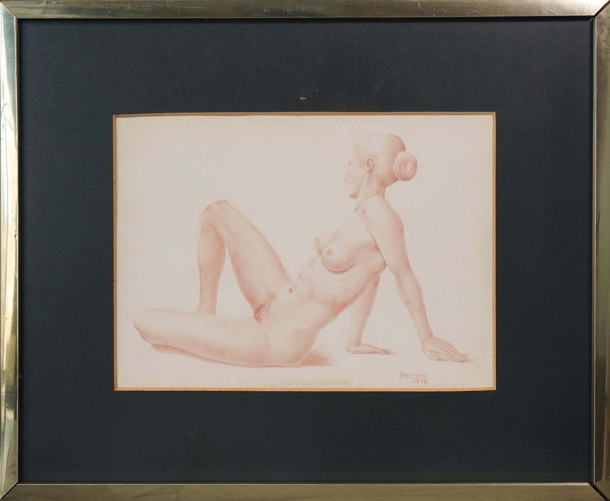 A drawing of a nude woman sitting on a chair.