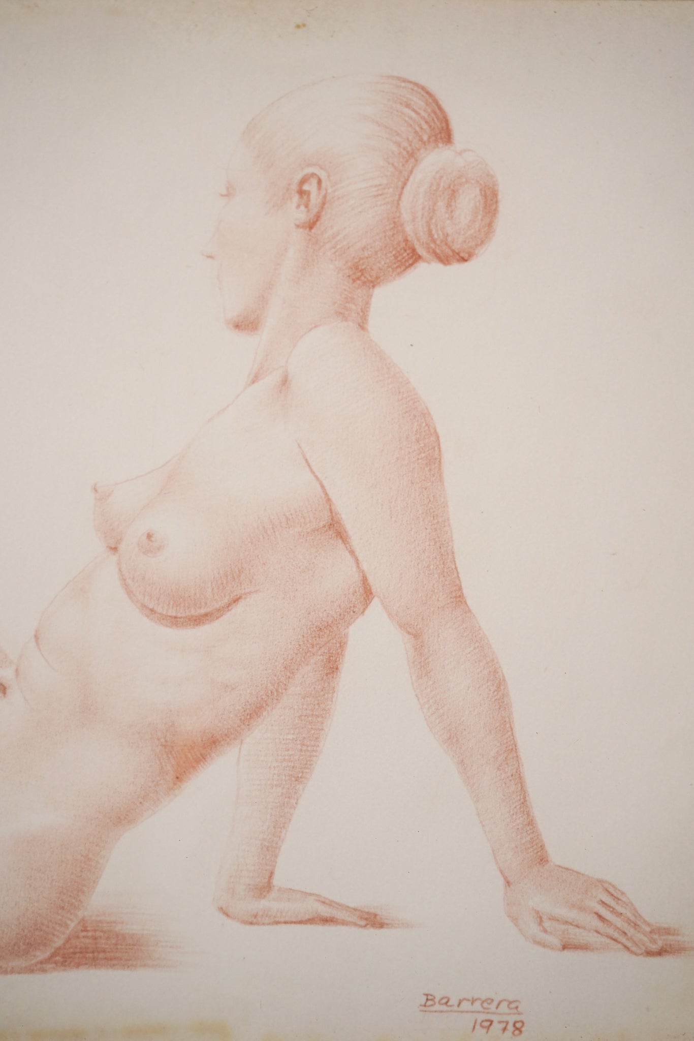 A drawing of a nude woman sitting on a chair.