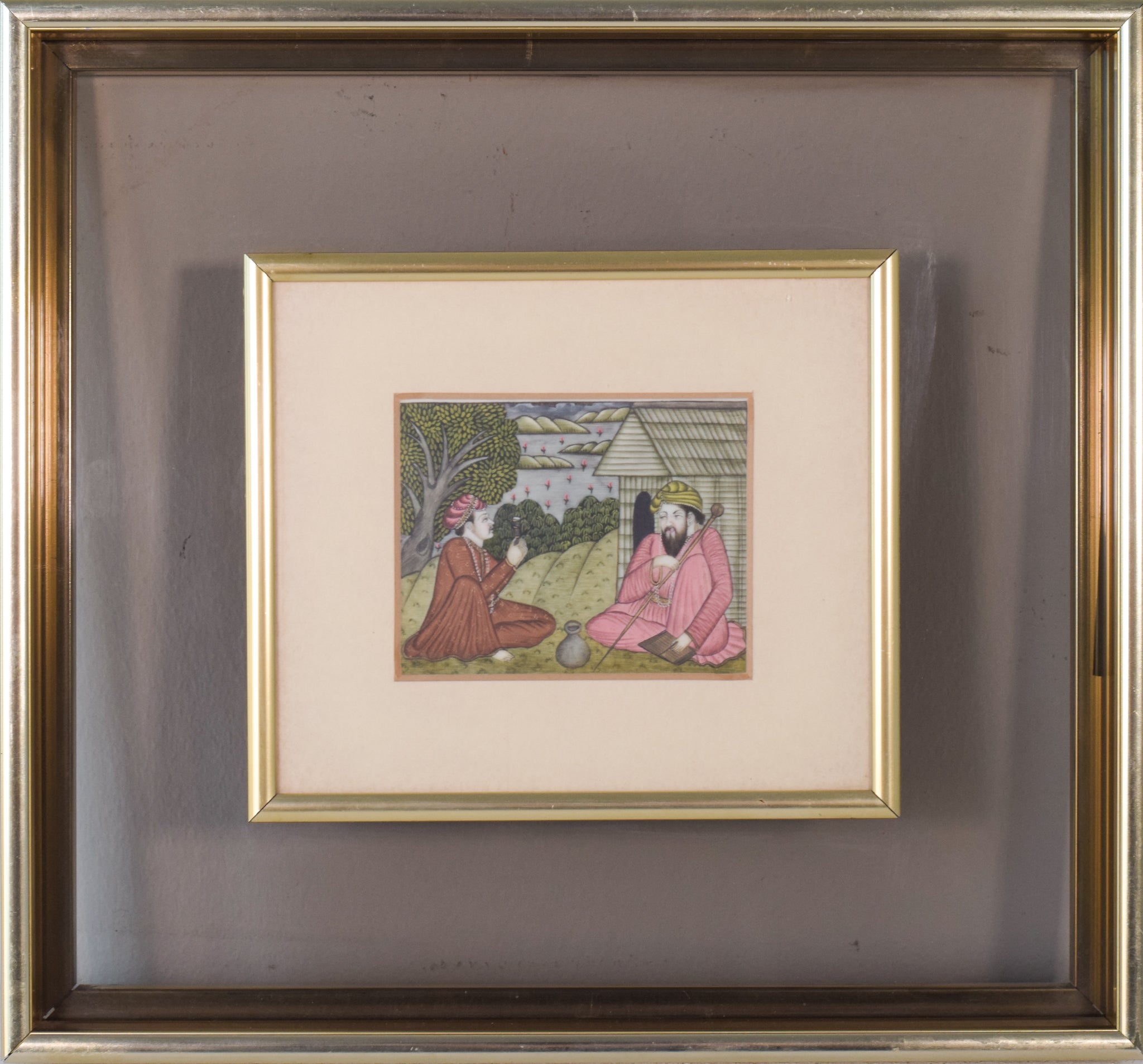 A painting of two men sitting on the ground in front of a house.