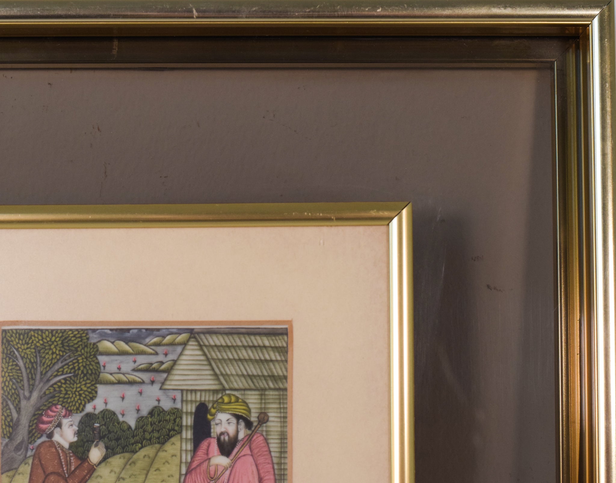 A painting of two men sitting on the ground in front of a house.