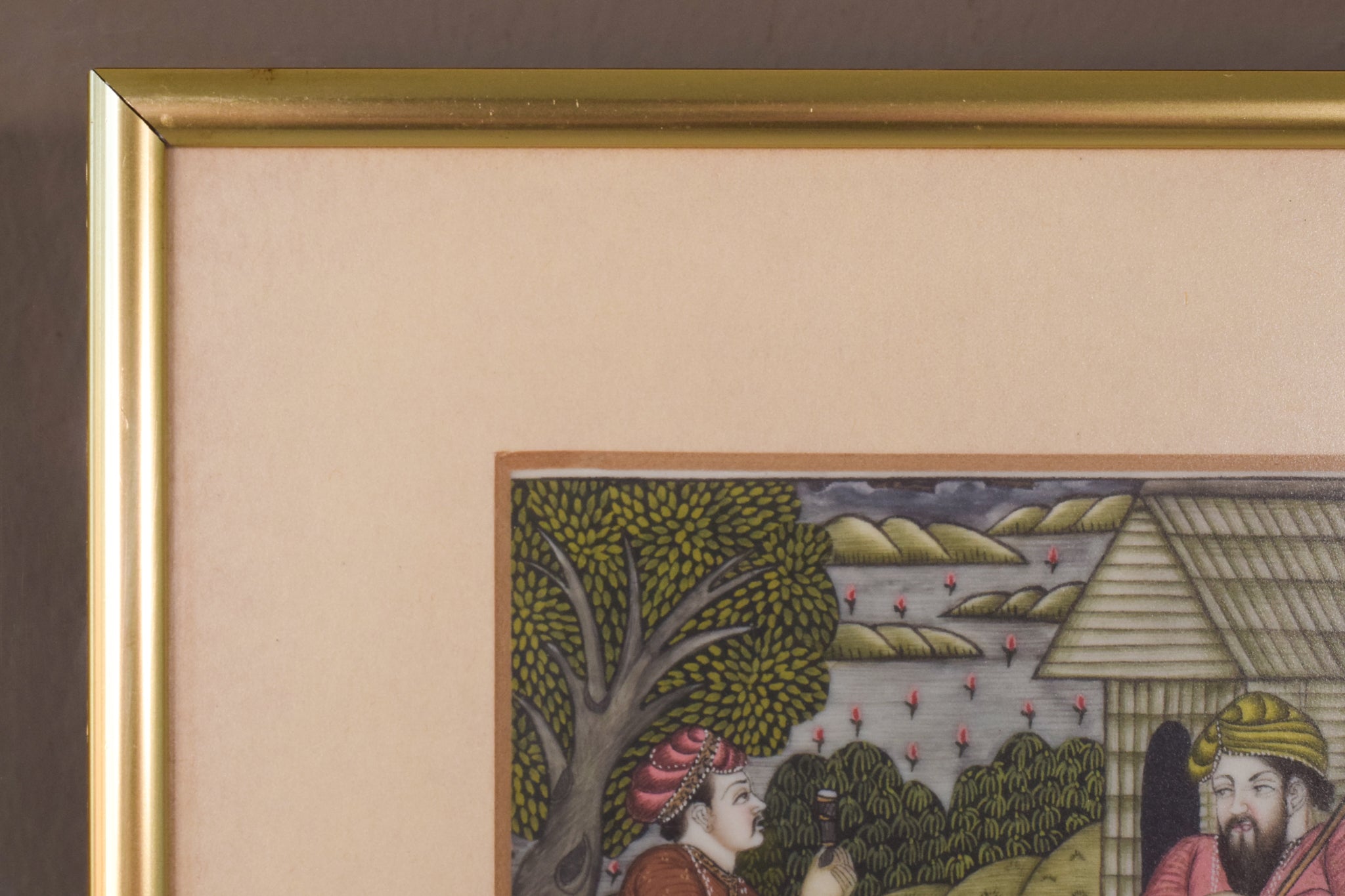 A painting of two men sitting on the ground in front of a house.