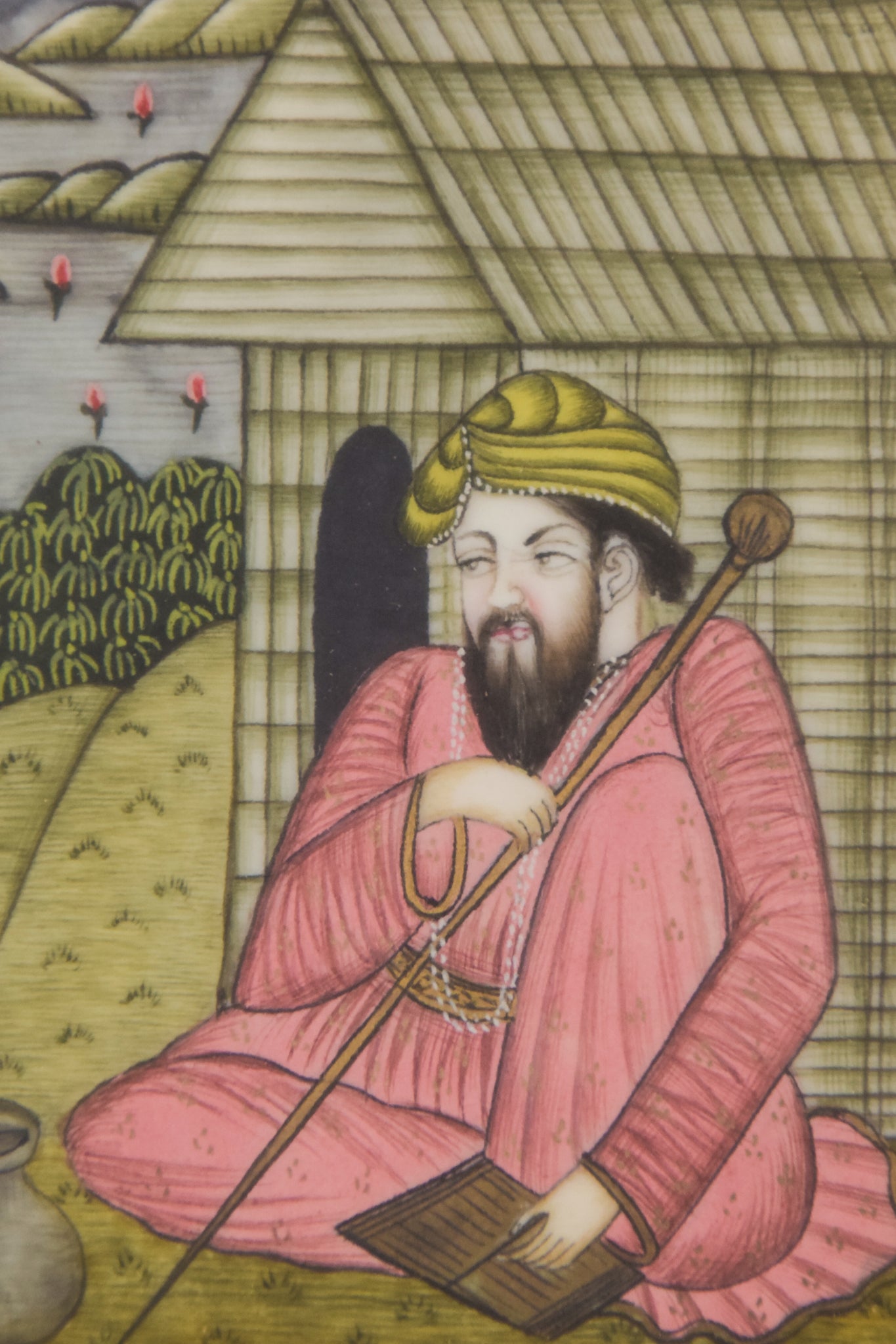 A painting of two men sitting on the ground in front of a house.