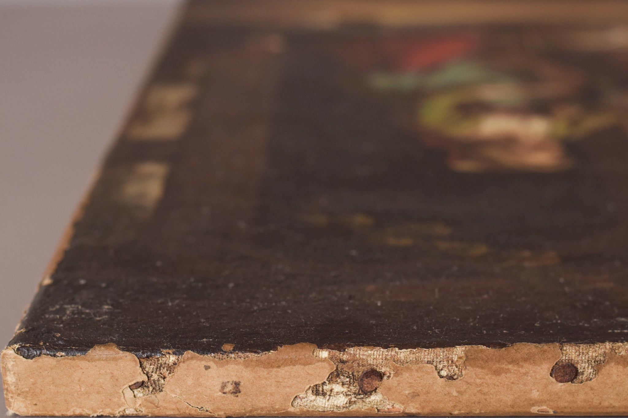 A painting of a man and two women and a cat in a courtyard.