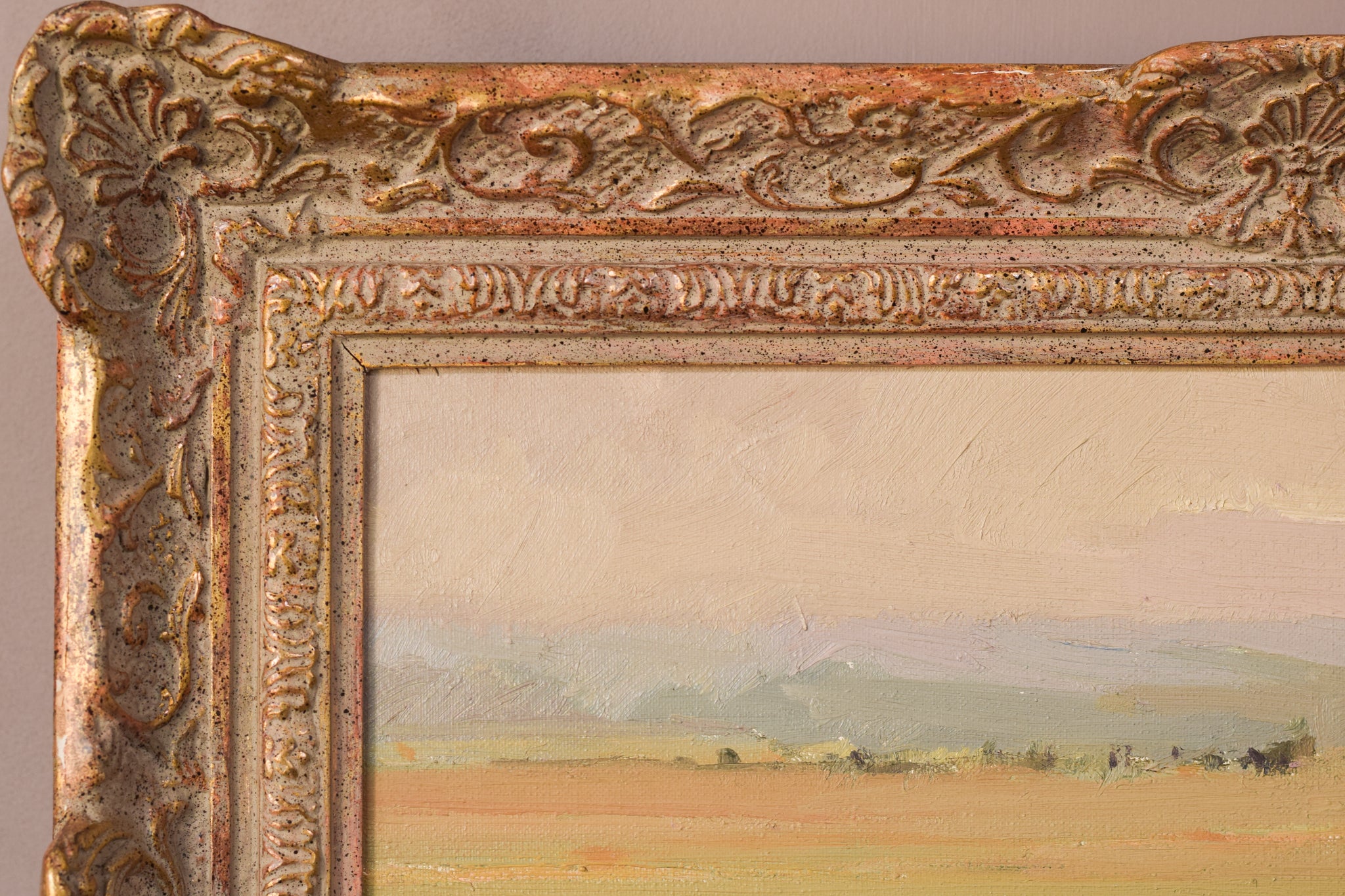 A painting of a field with a house in the distance.