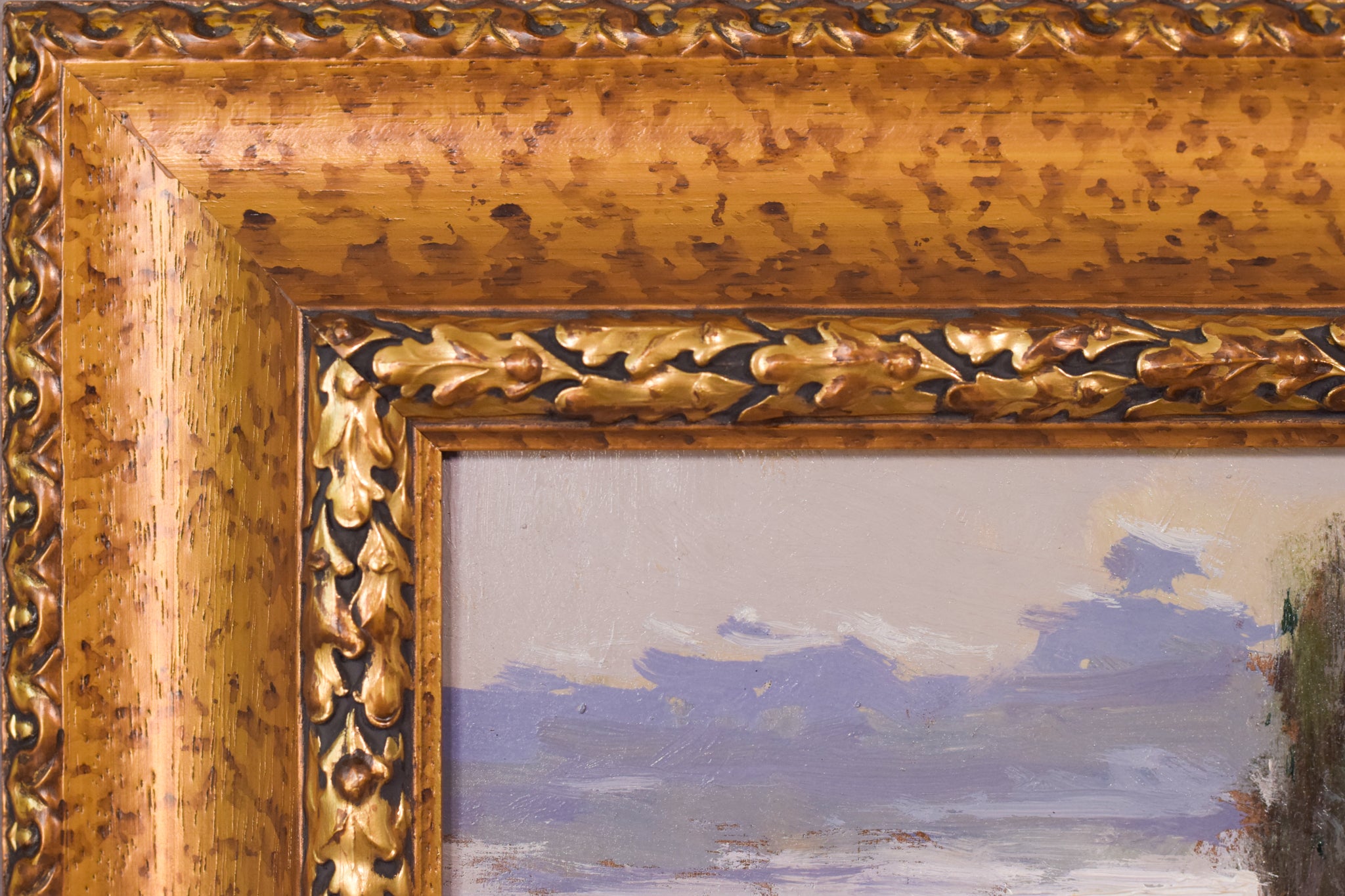 A painting of a landscape with a river and trees.