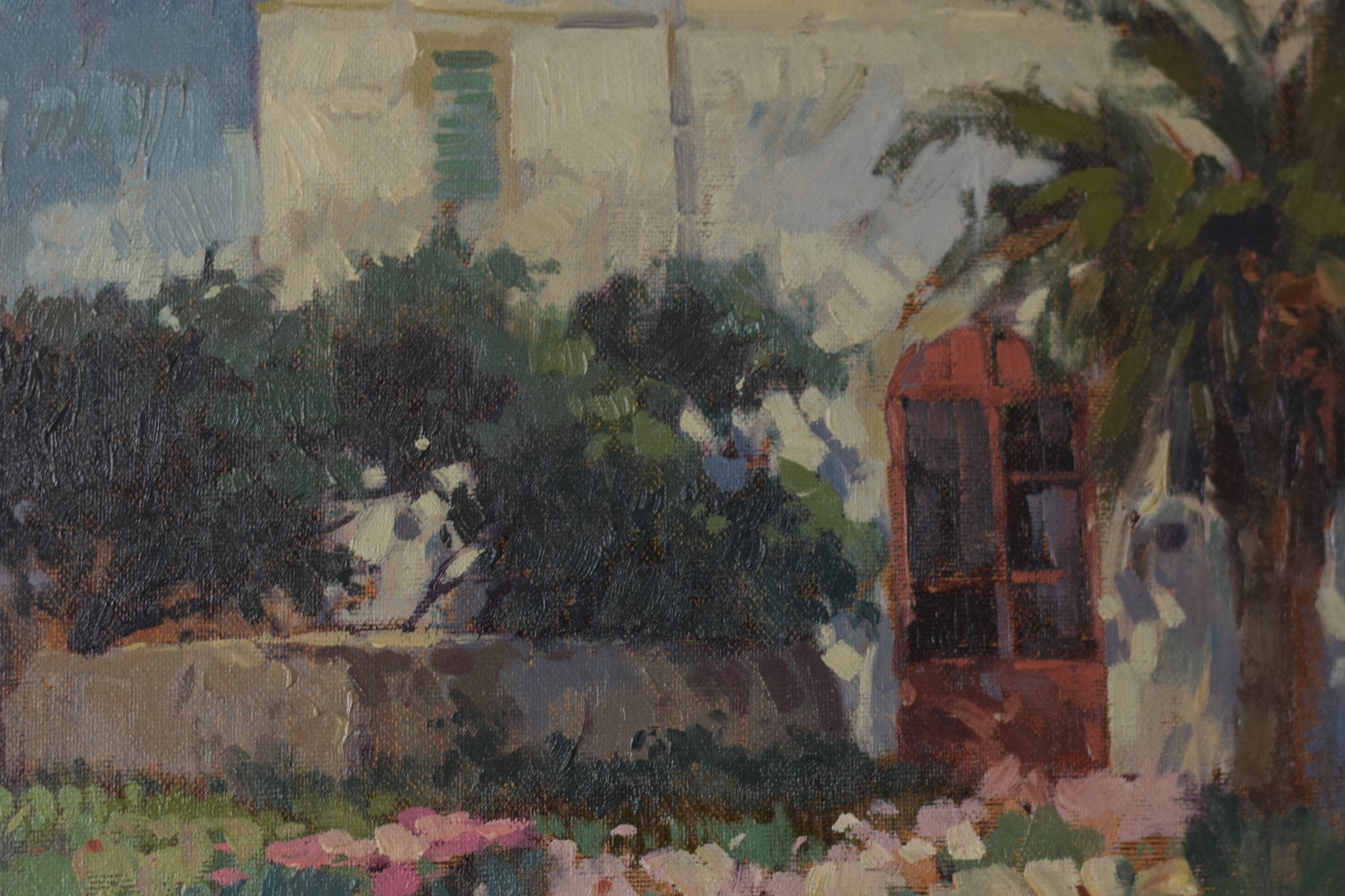A painting of a field of flowers in front of a building.