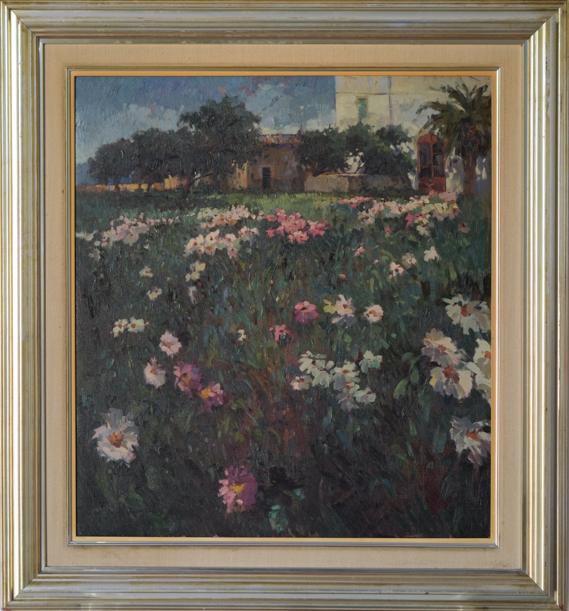 A painting of a field of flowers in front of a building.