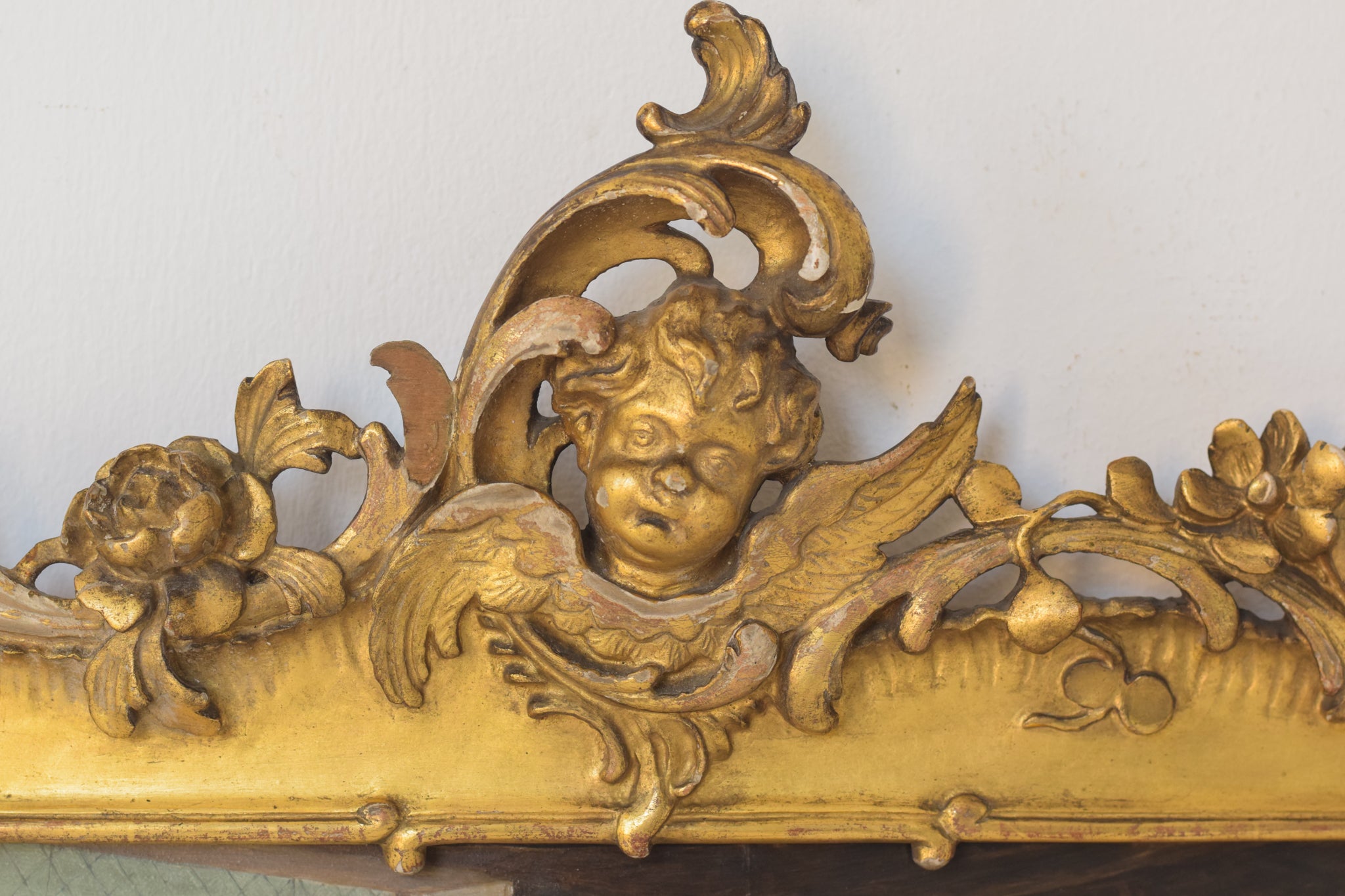 A painting of a group of people sitting around a table.