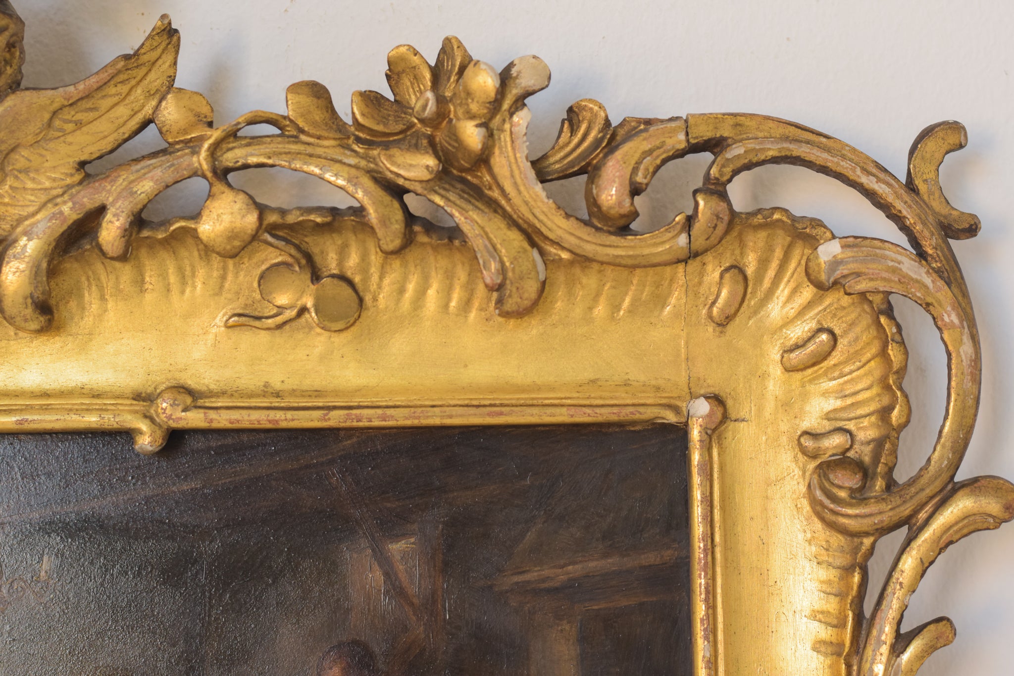 A painting of a group of people sitting around a table.