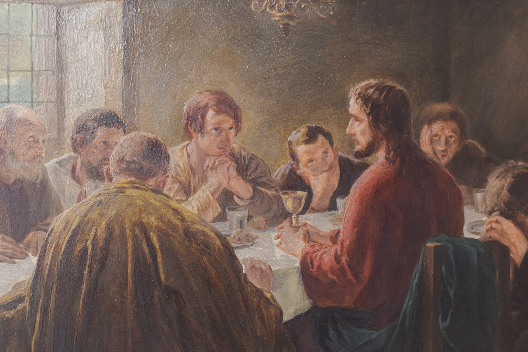A painting of a group of people sitting around a table.