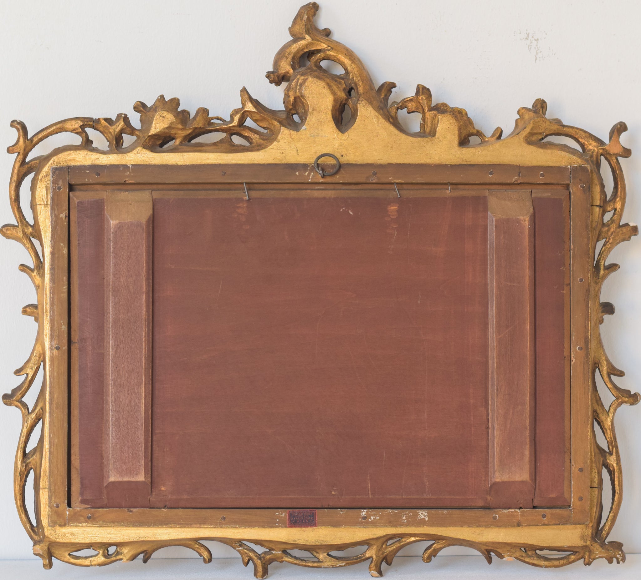 A painting of a group of people sitting around a table.