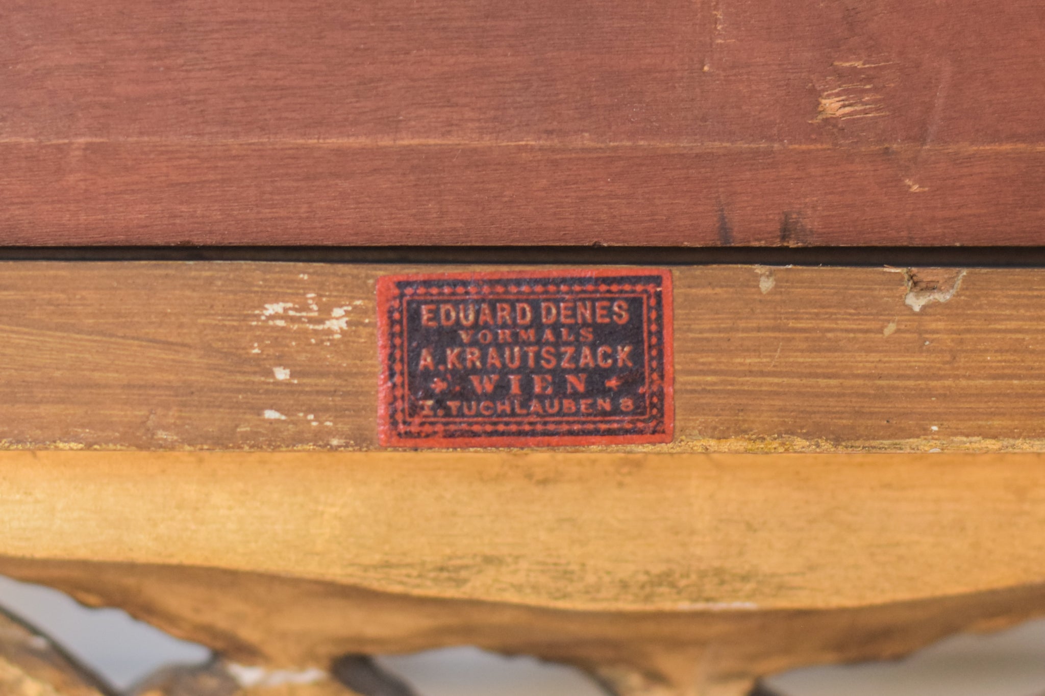 A painting of a group of people sitting around a table.