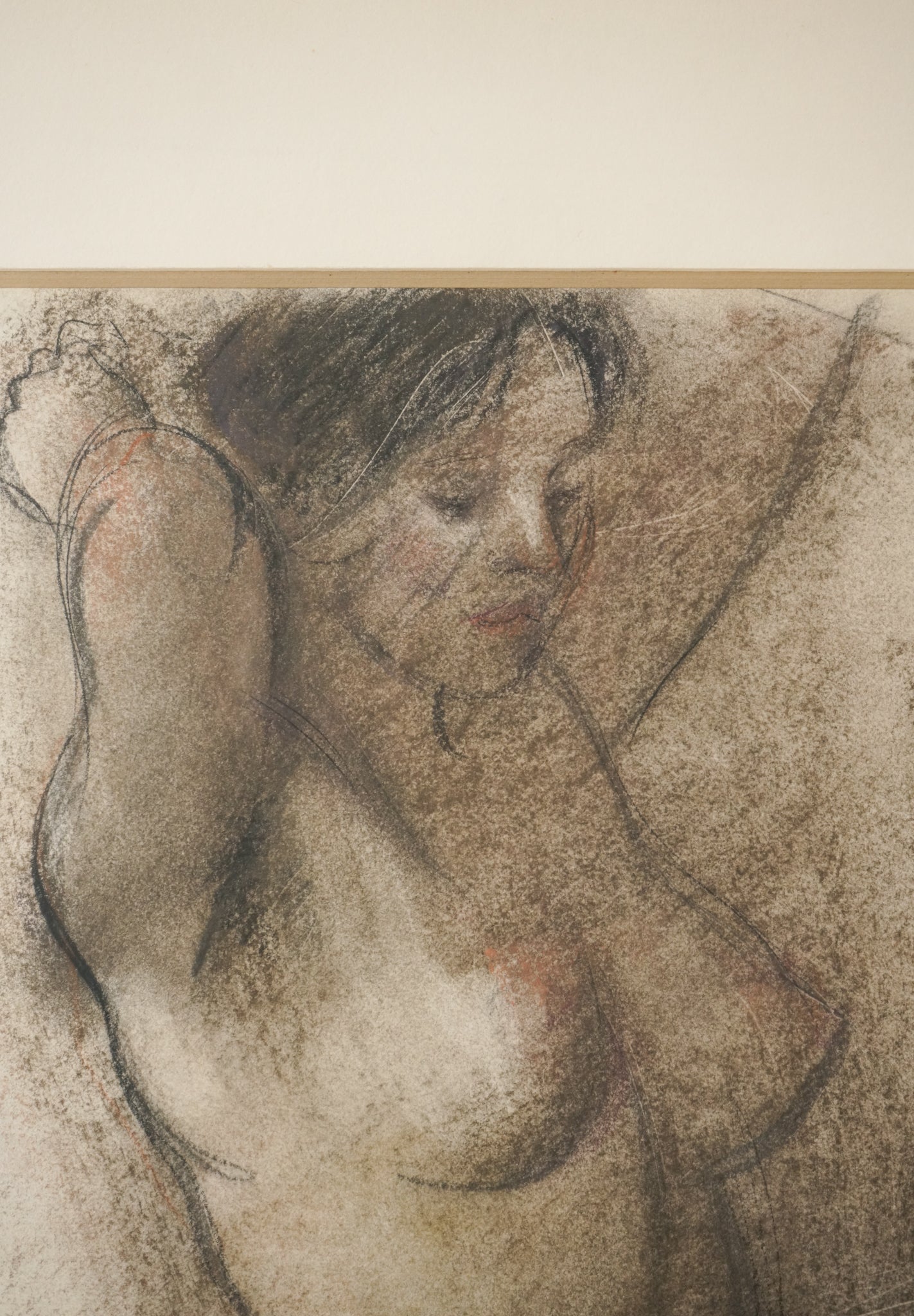 A drawing of a nude female standing in front of a wall.