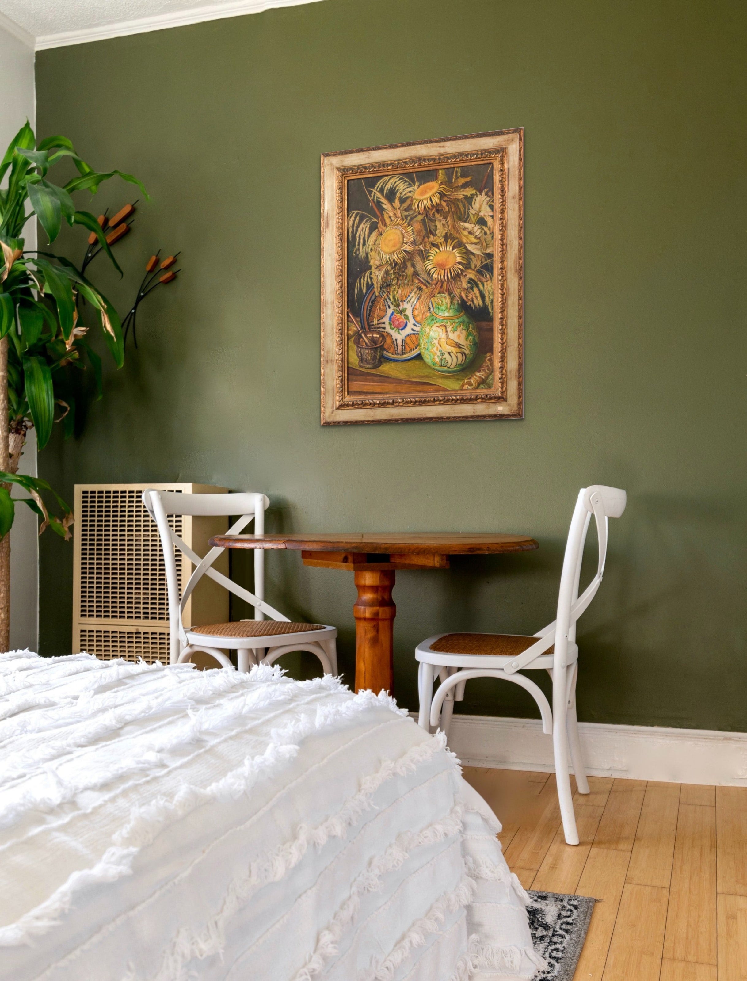 A painting of sunflowers in a vase on a table.