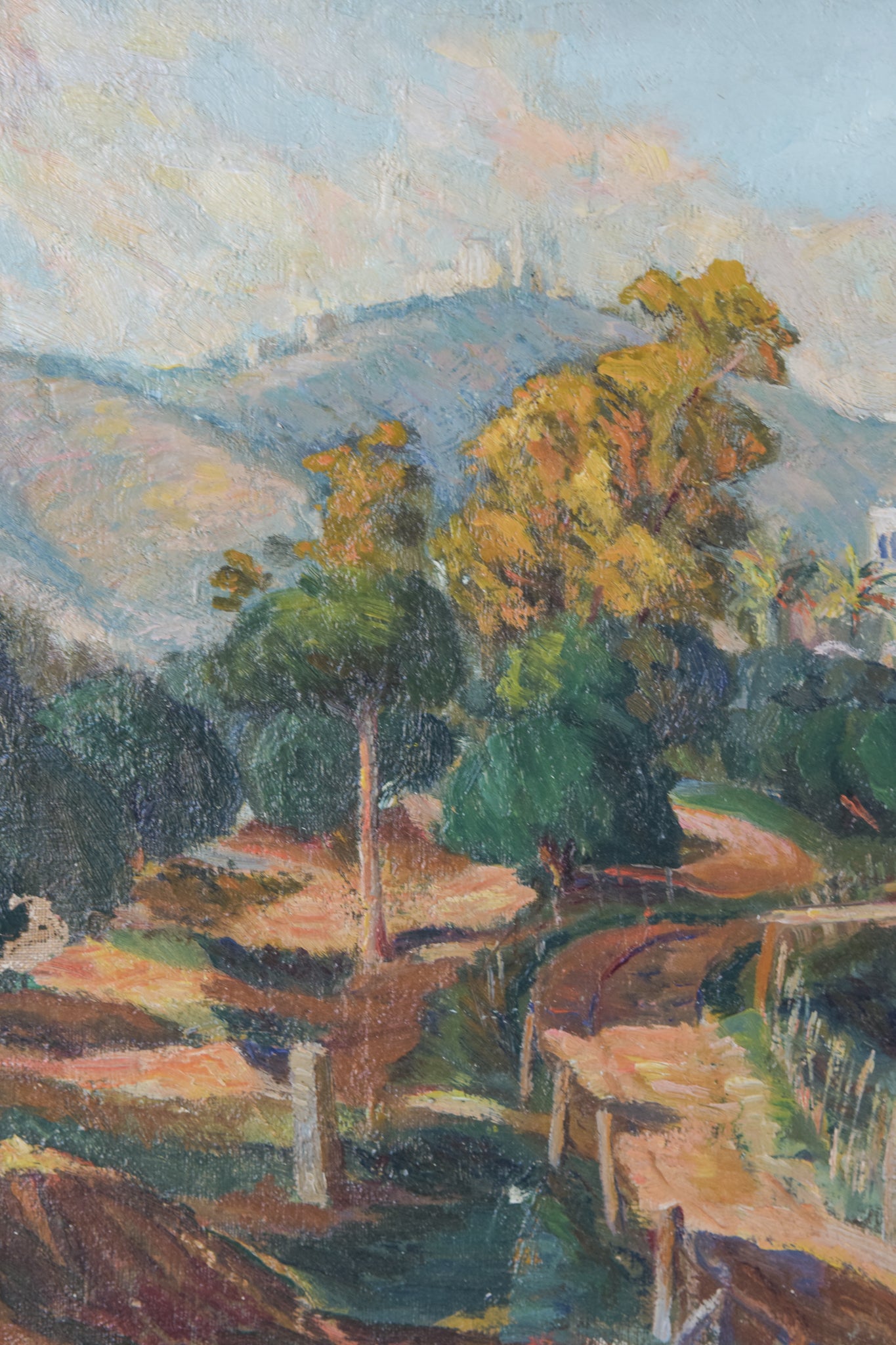 A painting of a landscape with trees and mountains in the background.