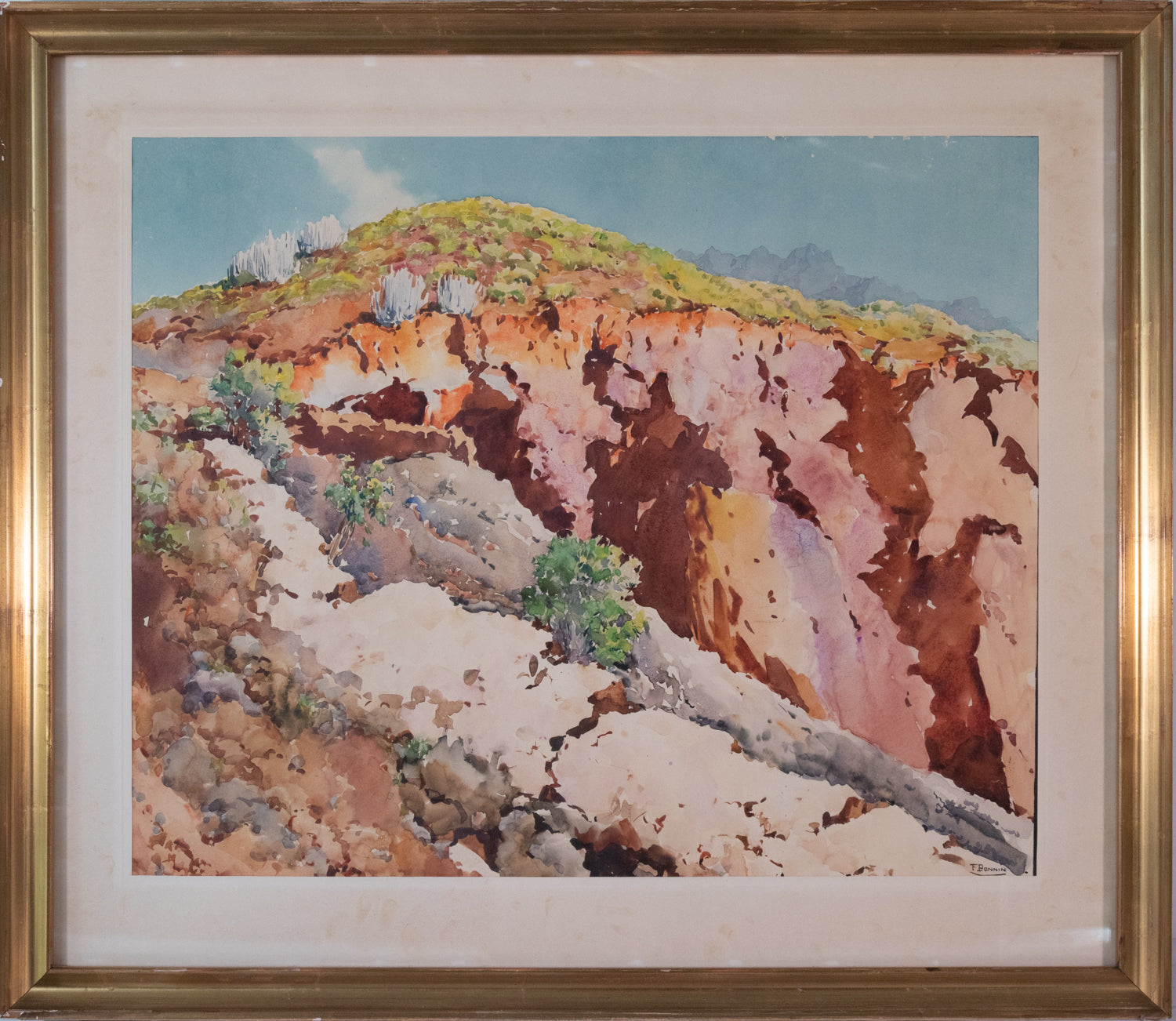 A watercolor painting of a rocky landscape with trees on a hillside.