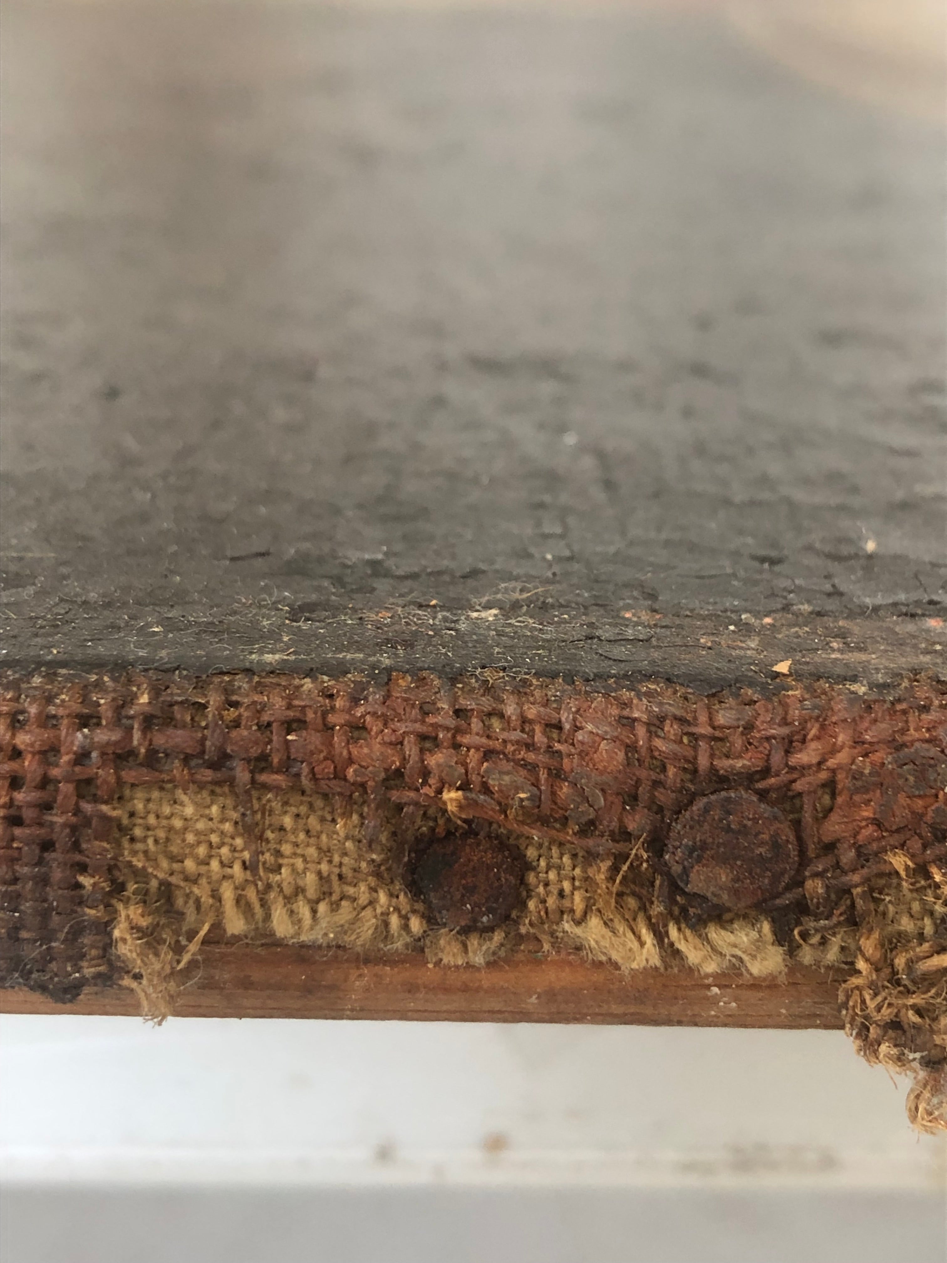 A painting of a woman holding a scythe and a dragon.