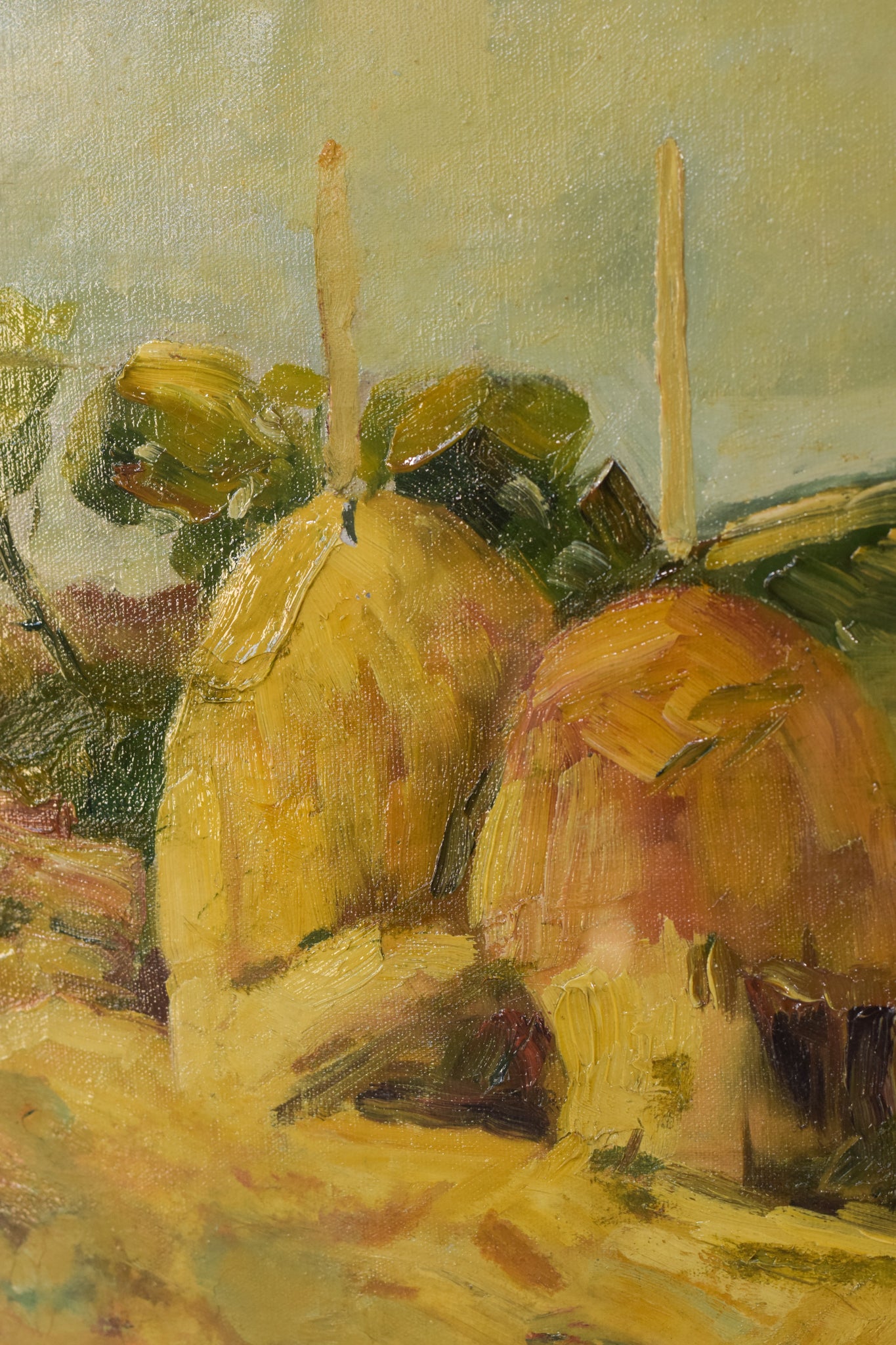 A painting of hay bales in a field with a tree in the background.