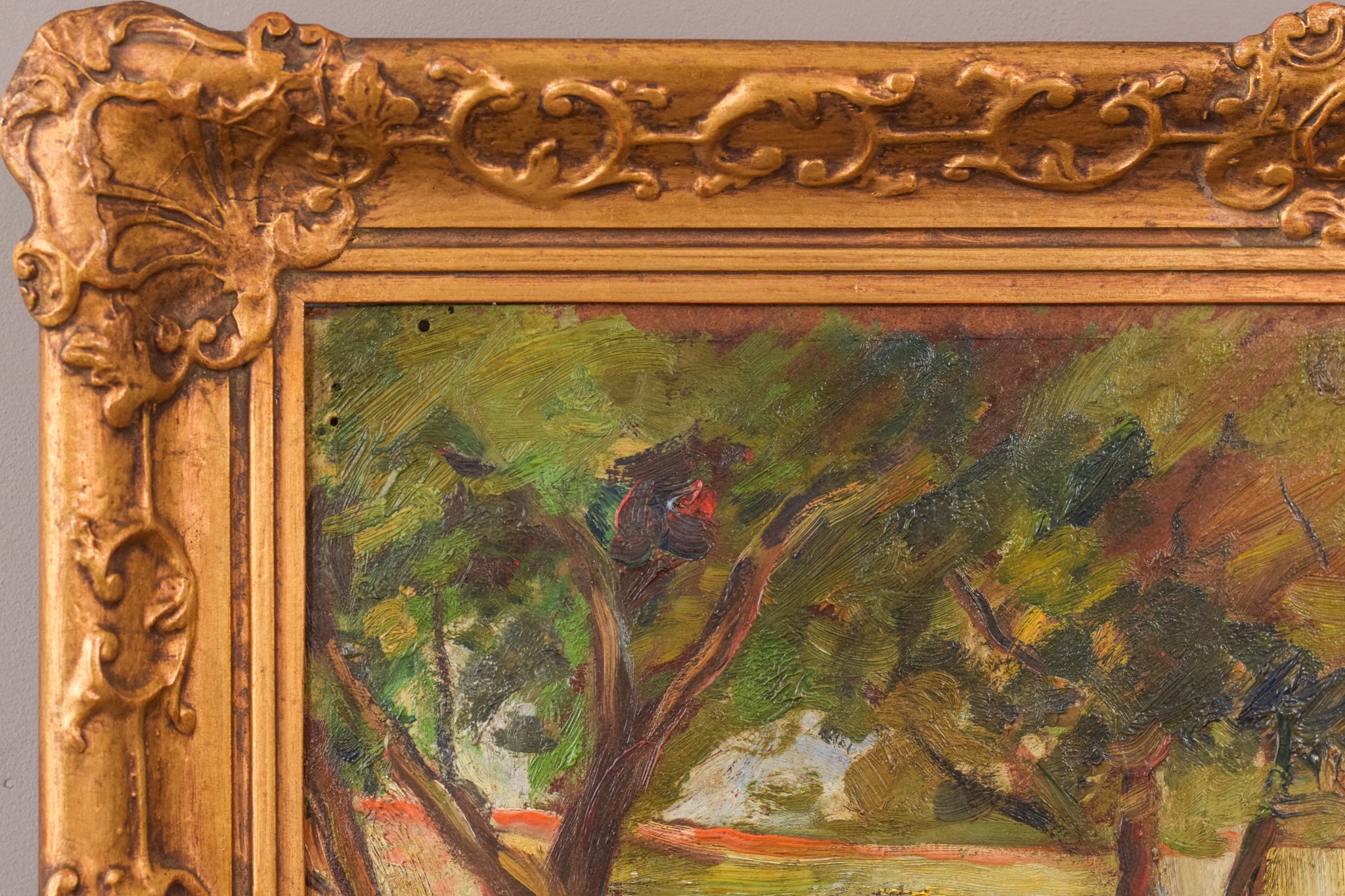 A painting of trees in a wooded area with a house in the background.