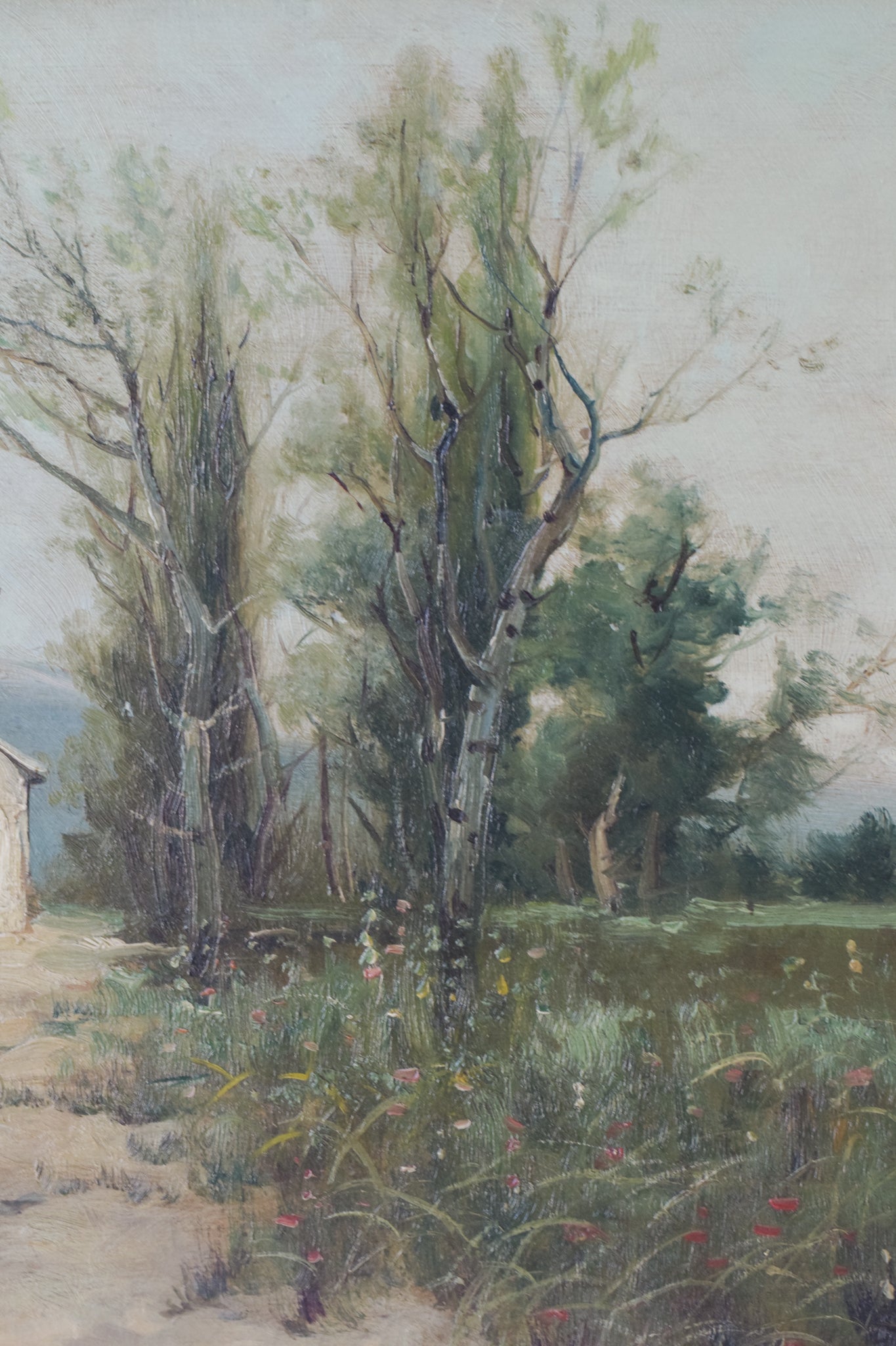A painting of an old house in the middle of a field.