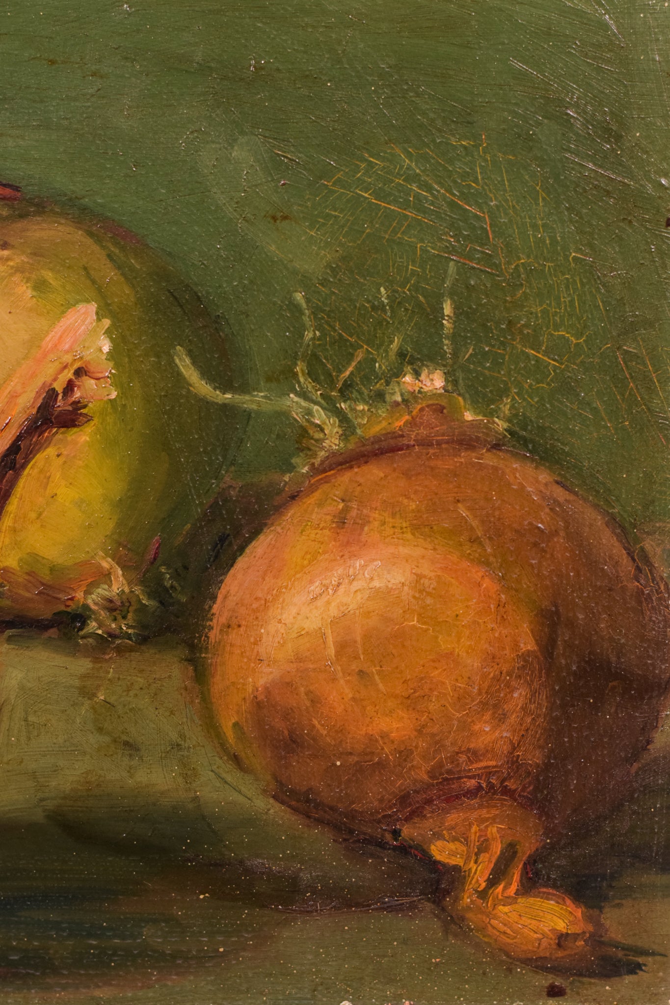 A painting of three onions on a green surface.