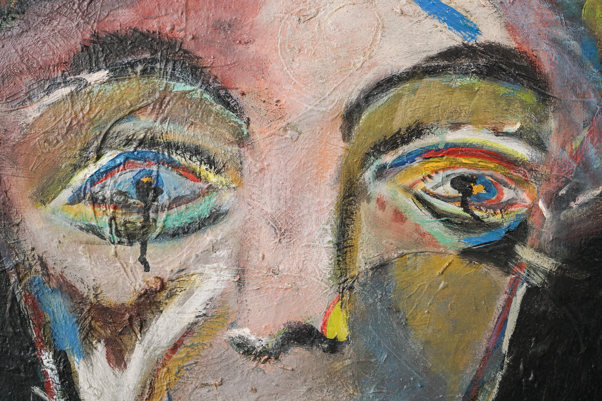 A painting of a woman's face on a black background.