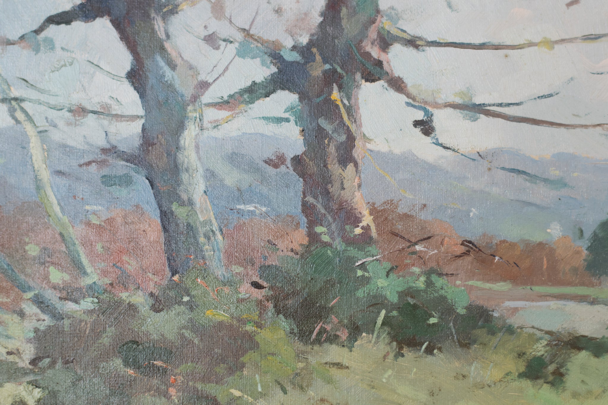 A painting of a landscape with trees in the foreground.