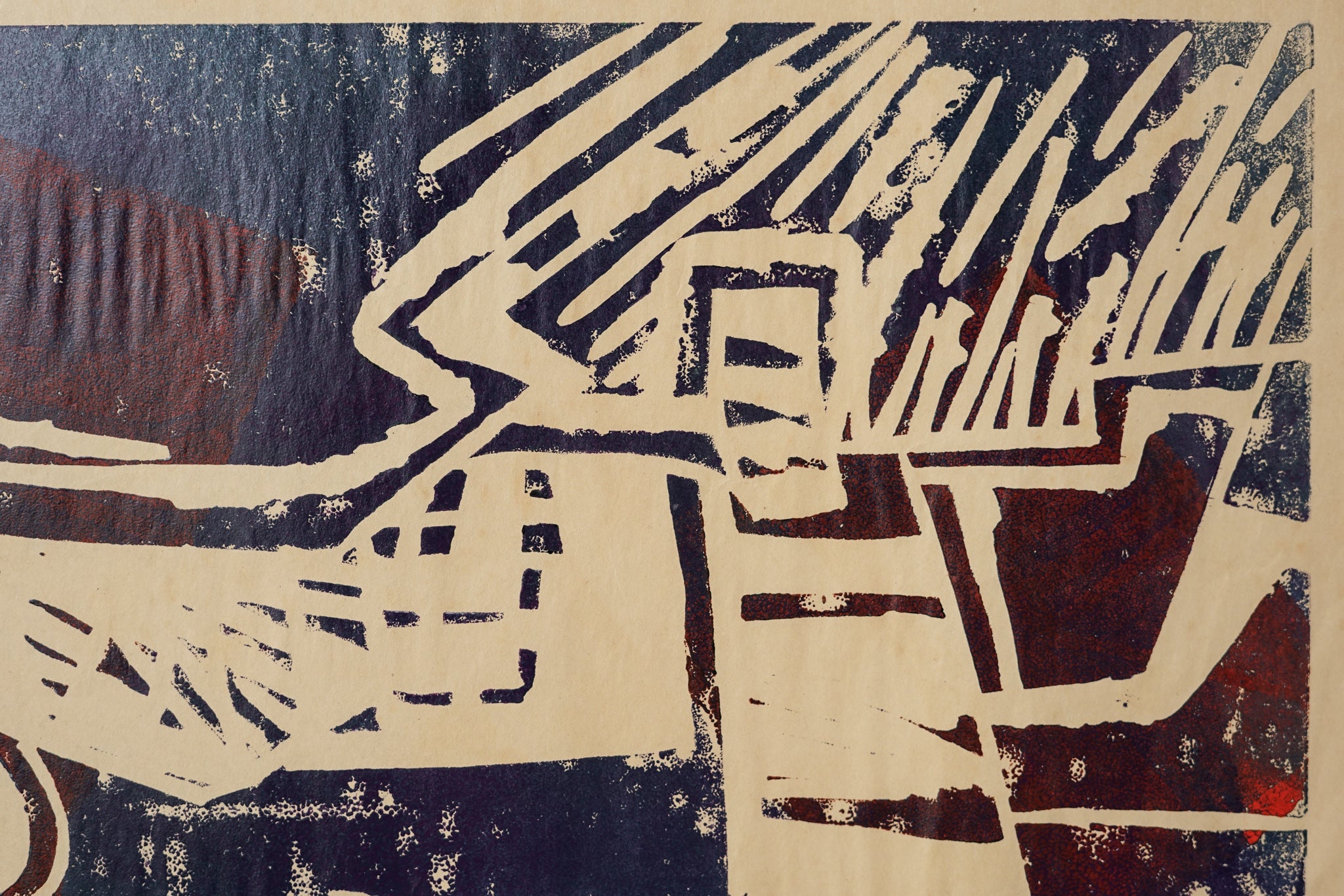 A painting of a green and red design on a black background.