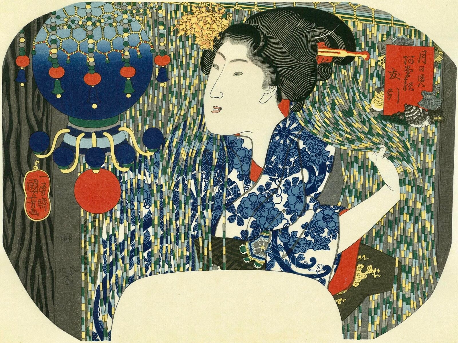 A woman in a blue and white kimono sitting in front of a mirror.