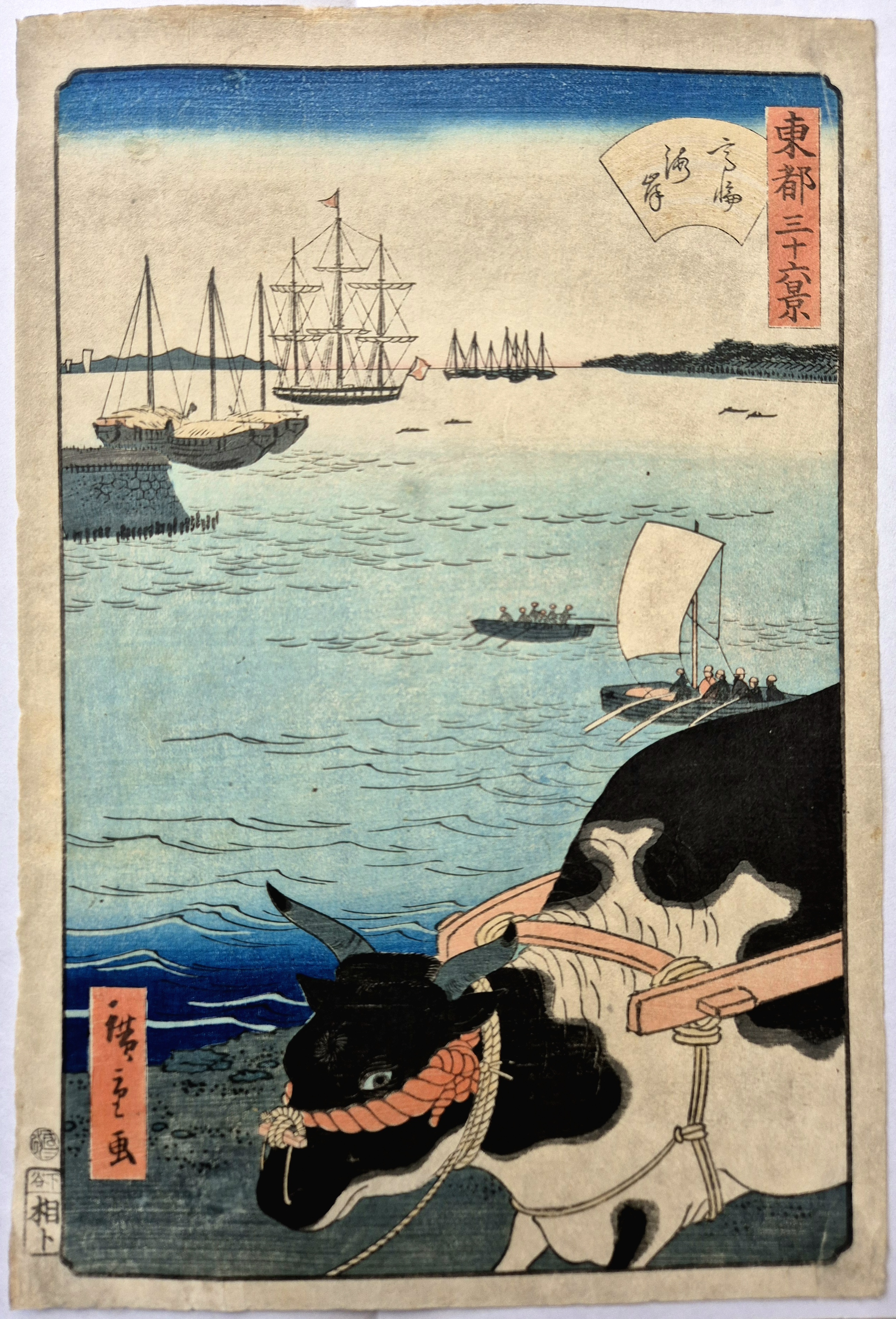 A woodblock print depicting a black-and-white ox pulling a cart in the foreground, with a harbor scene and sailing ships in the background.