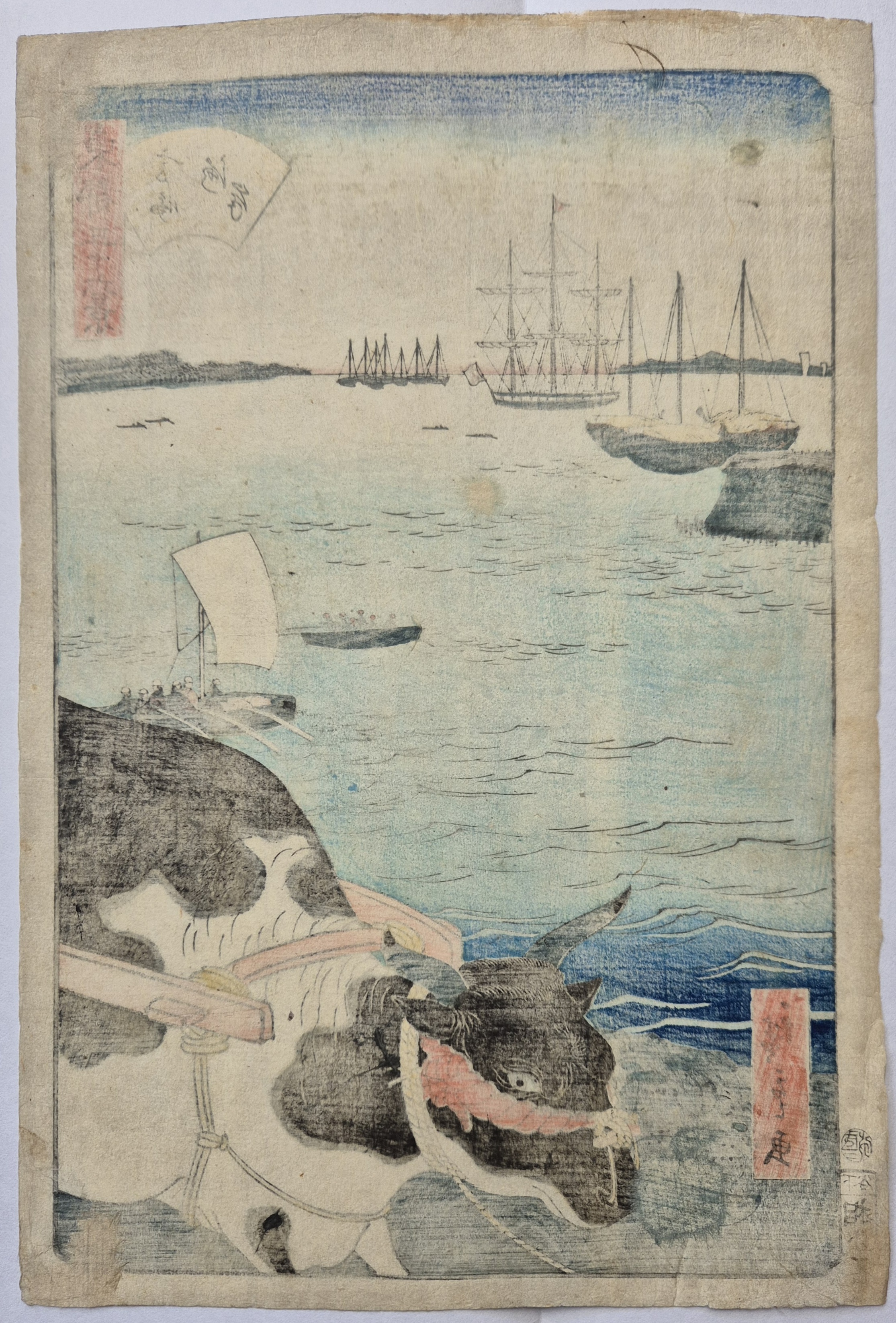 A woodblock print depicting a black-and-white ox pulling a cart in the foreground, with a harbor scene and sailing ships in the background.