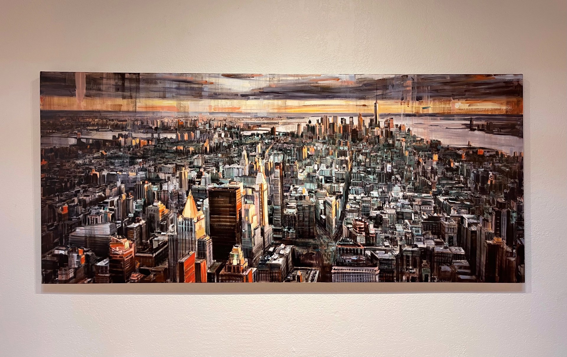 A painting of a cityscape with a sunset in the background.