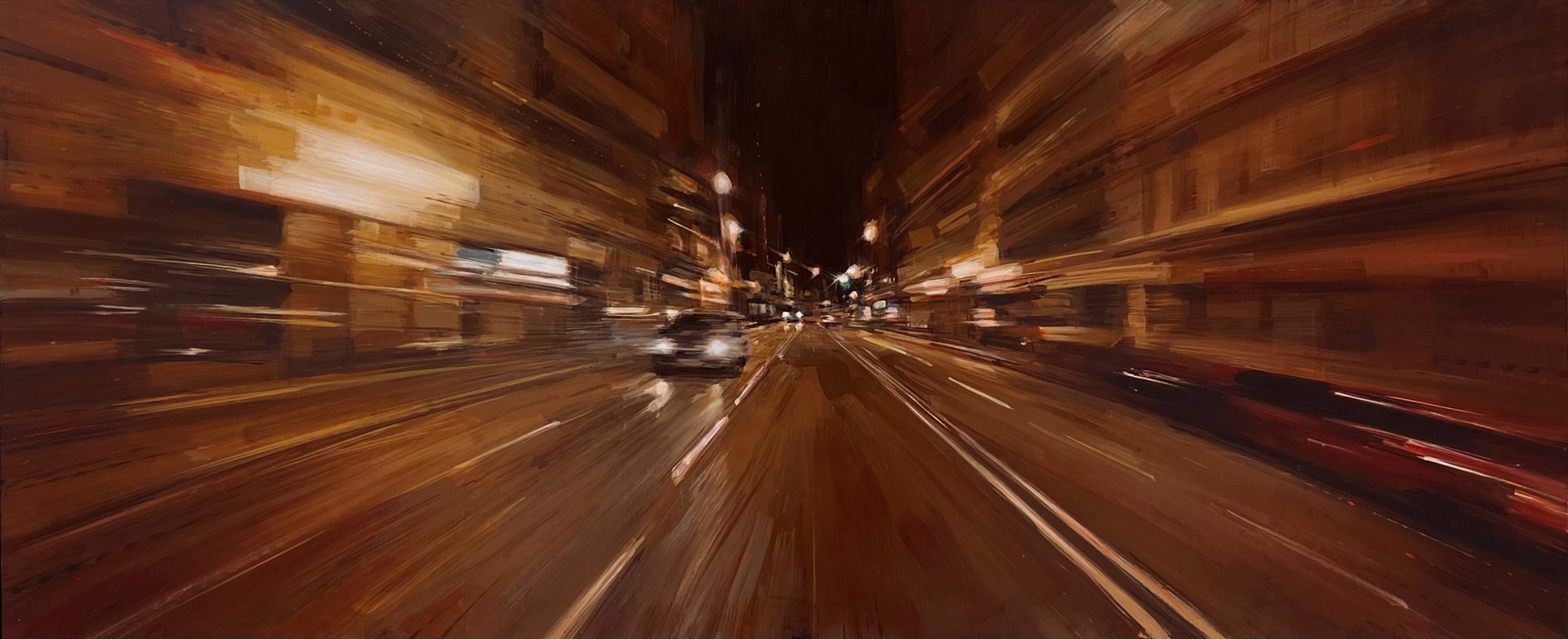 A blurry image of a city street at night.