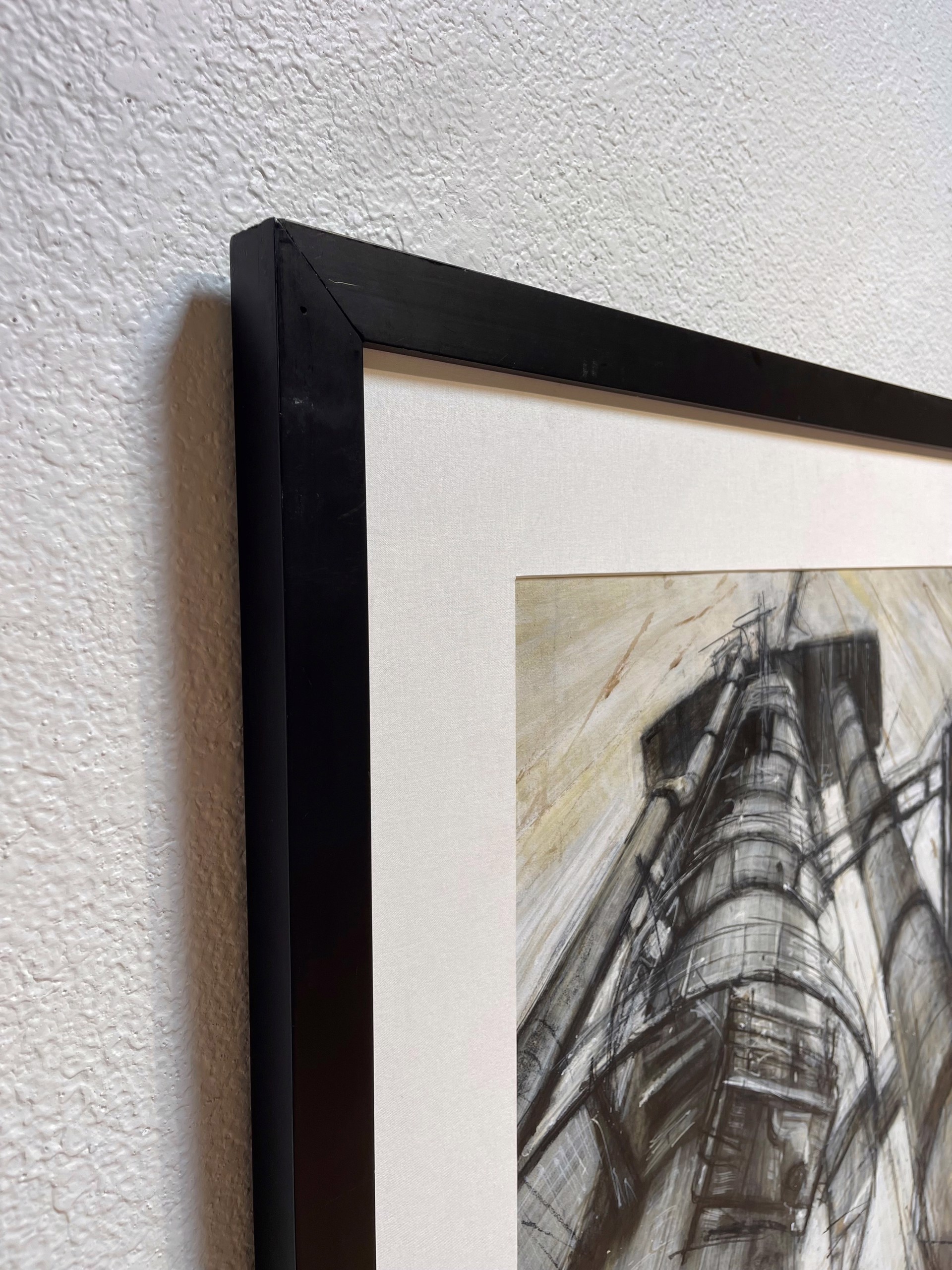 A gritty charcoal study of towering industrial machinery against a textured background.