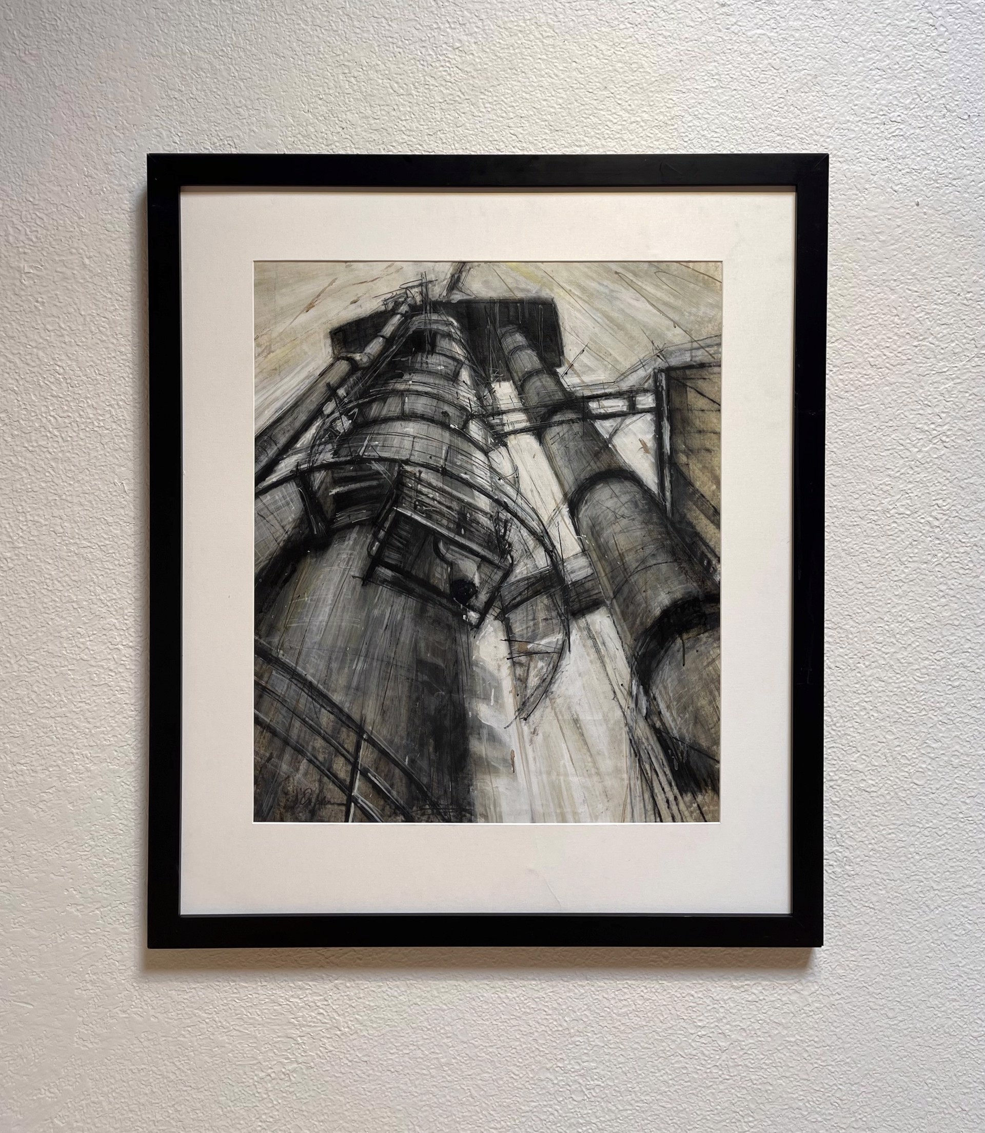 A gritty charcoal study of towering industrial machinery against a textured background.