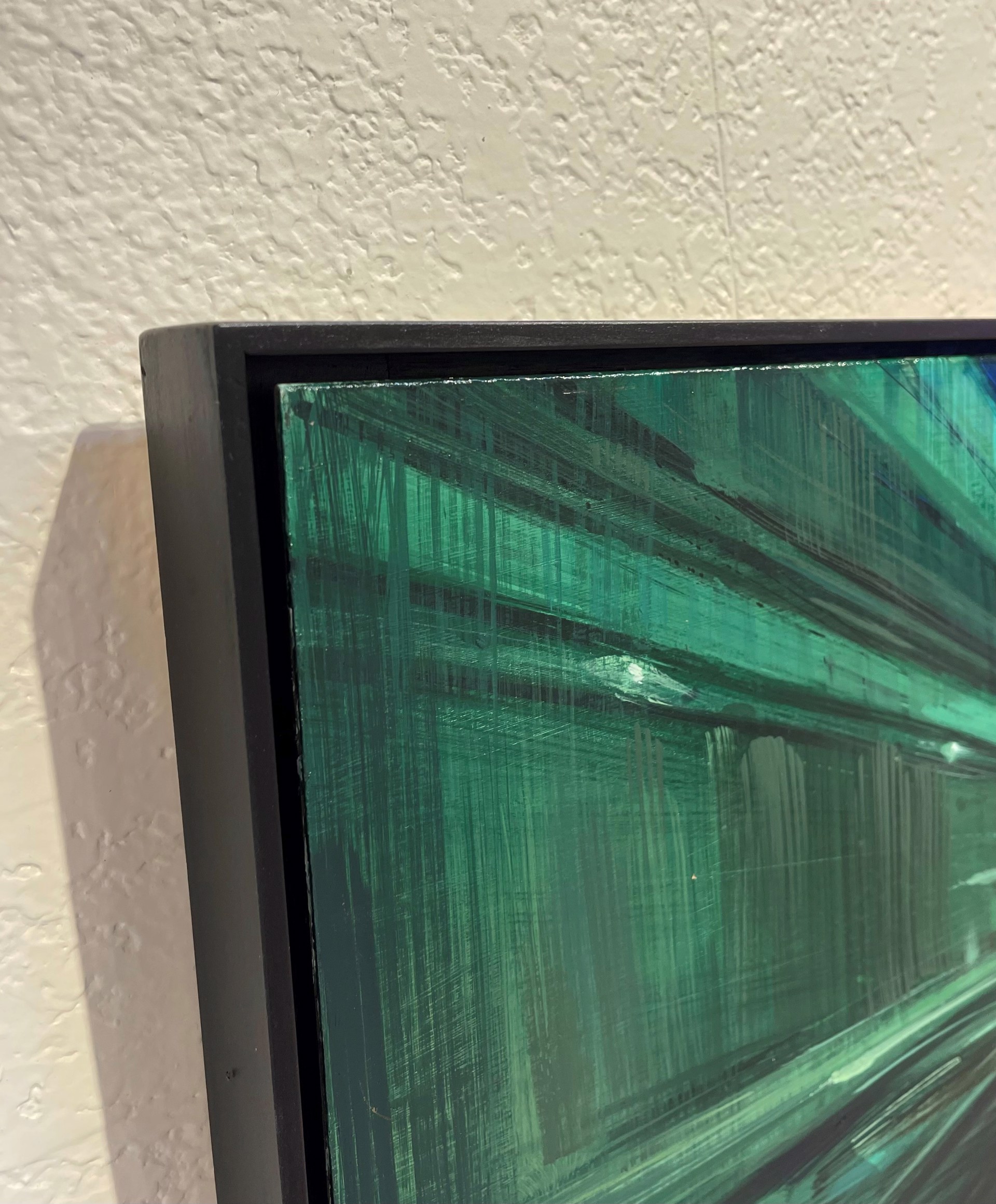 A first-person perspective of a rapid journey through a dark, green-lit urban corridor.