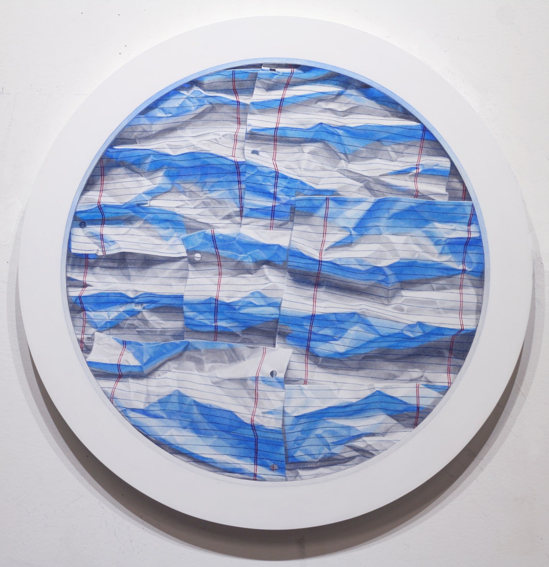 A circular painting on a white wall with blue and red lines.