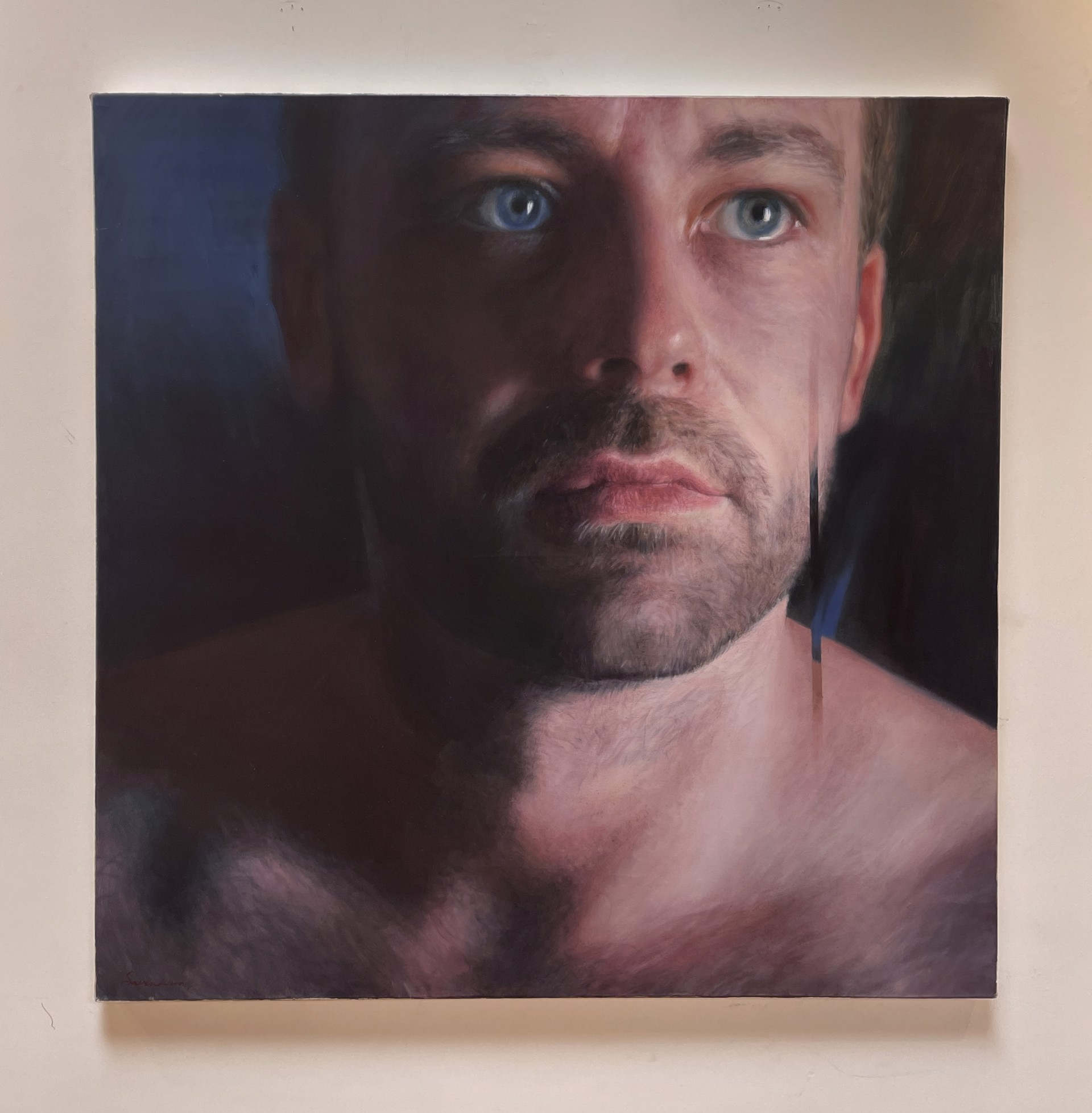 A painting of a man with blue eyes. 