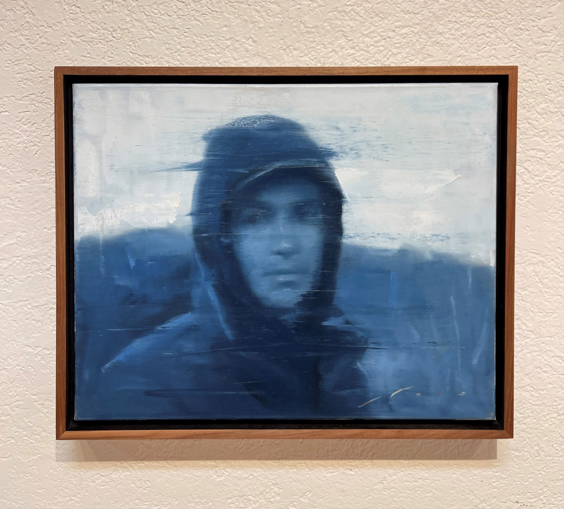 A painting of a man wearing a hat and jacket.