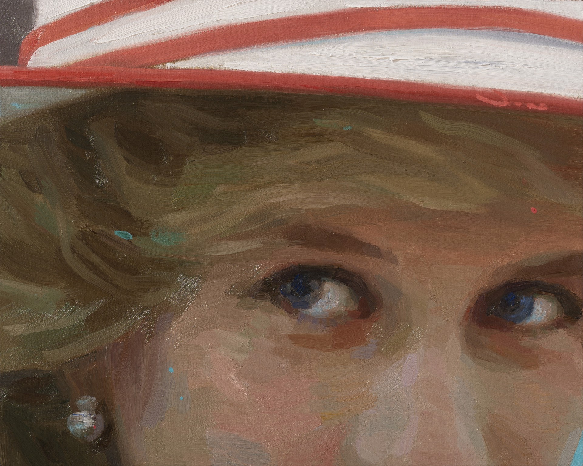 A close-up portrait of a figure wearing a red and white hat, focusing on expressive eyes.