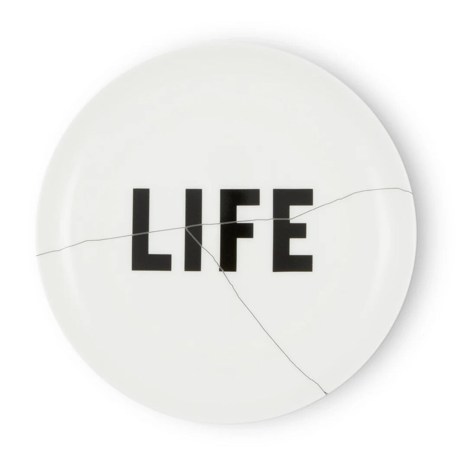 A white plate with the word LIFE written on it.