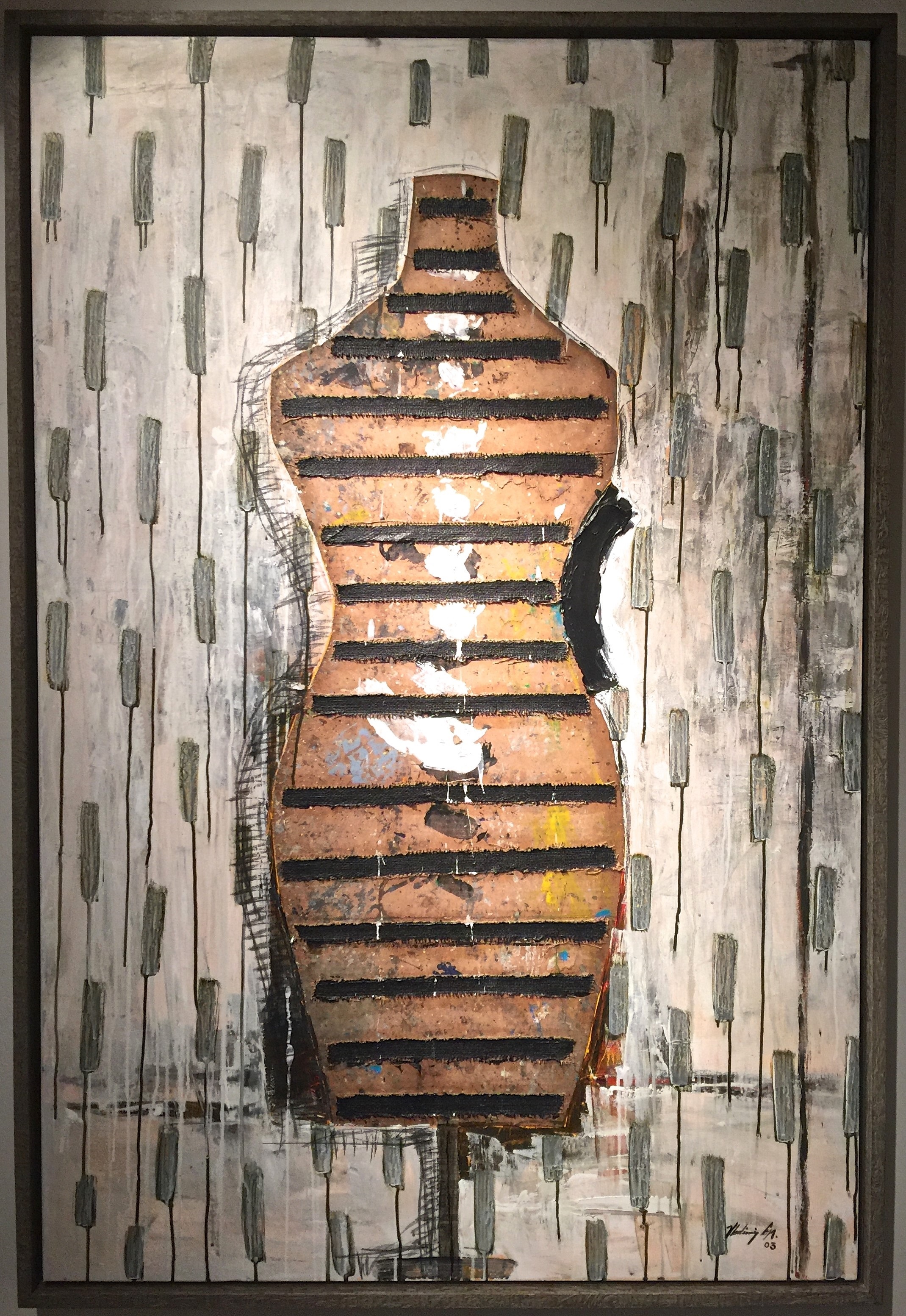 A painting of a mannequin on a wall in a room.