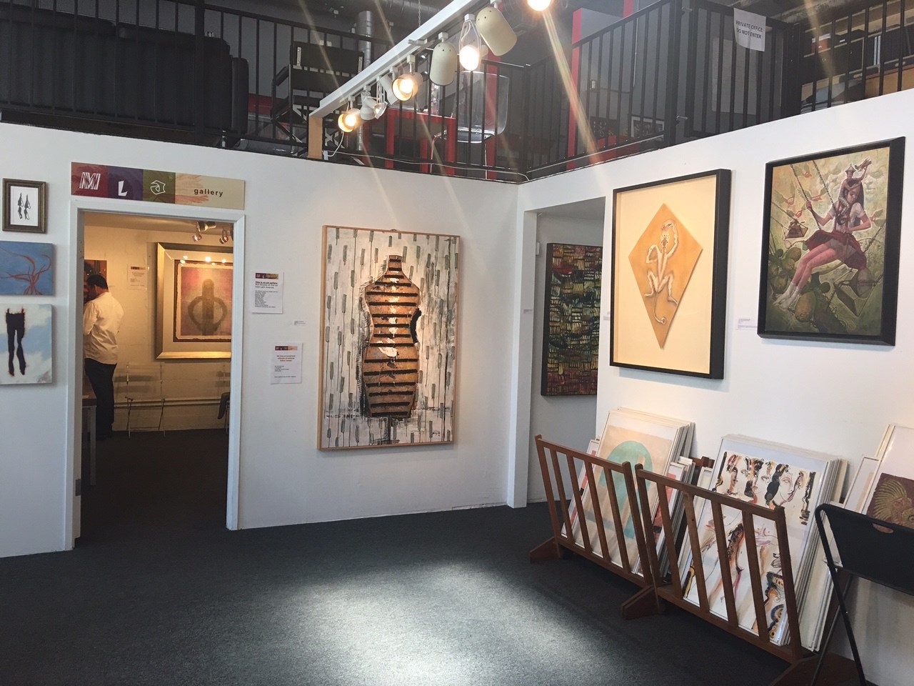 A painting of a mannequin on a wall in a room.