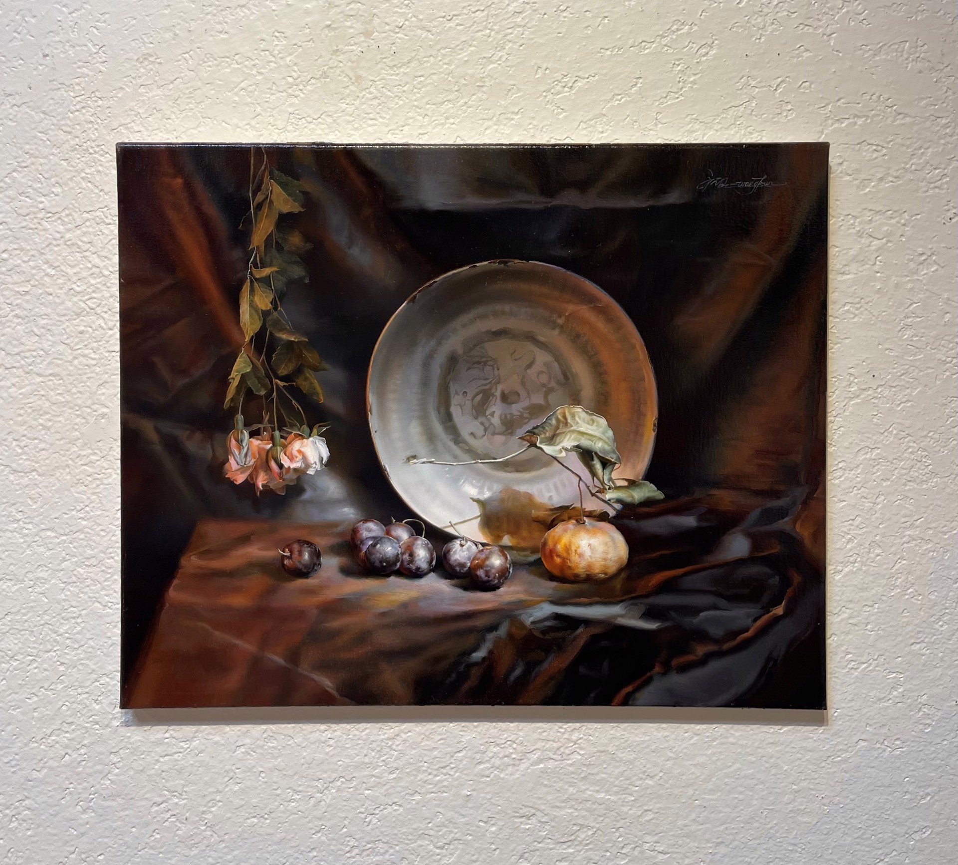A painting of a plate and some fruit on a table.