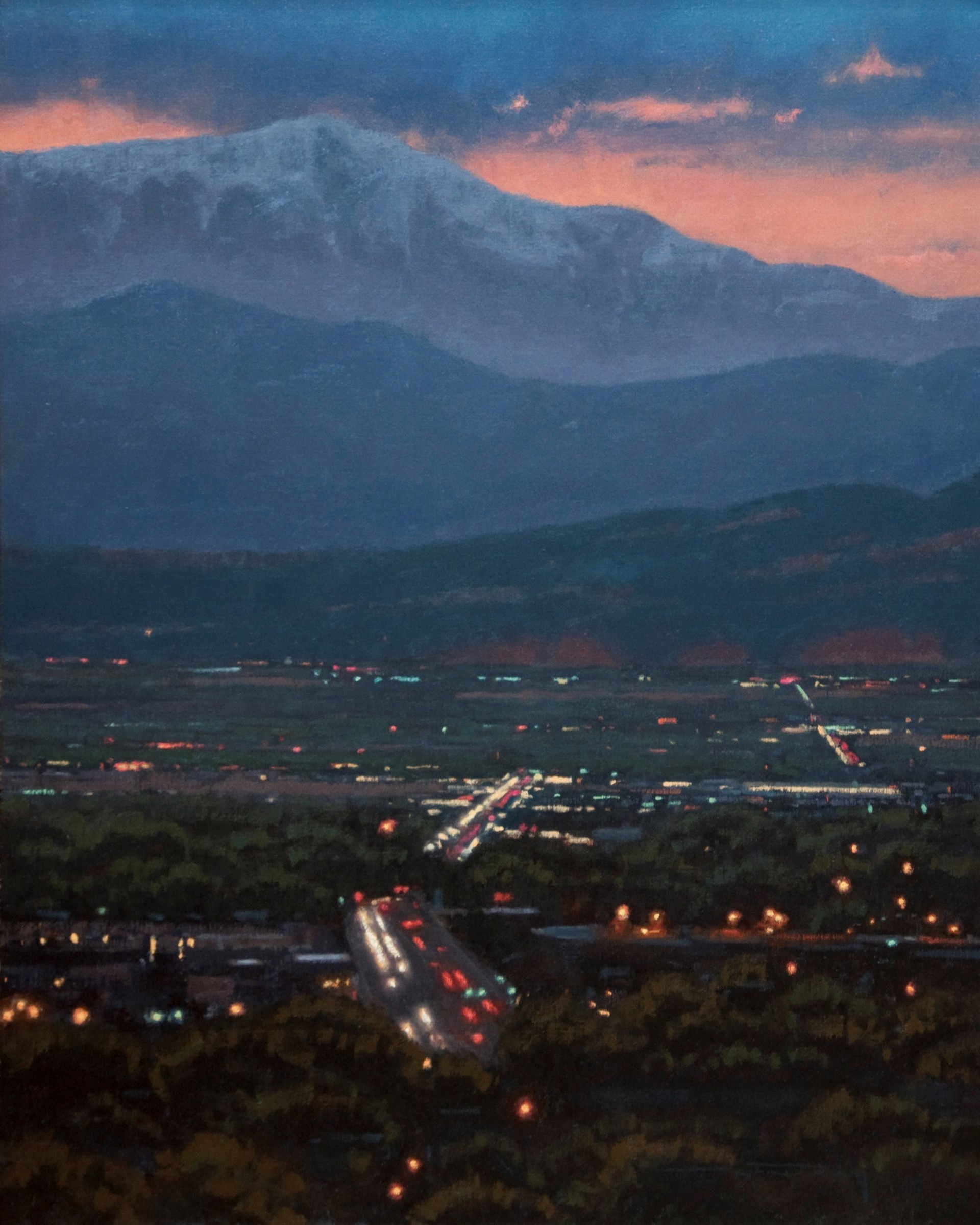 A nocturnal landscape painting featuring a snow-capped mountain over a town with glowing lights.