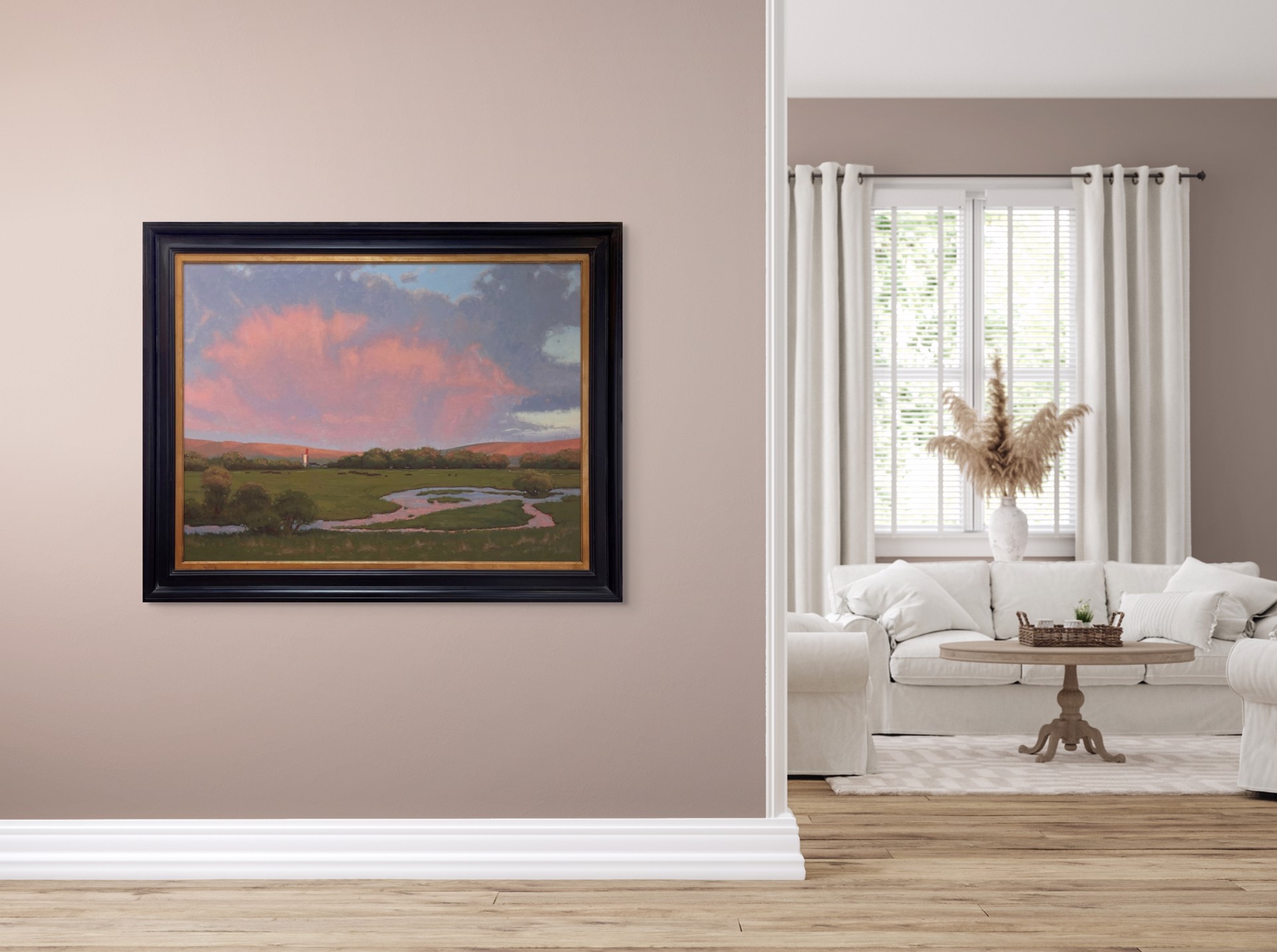 A serene landscape painting featuring a winding stream, green meadow, and dramatic pink clouds over distant hills.