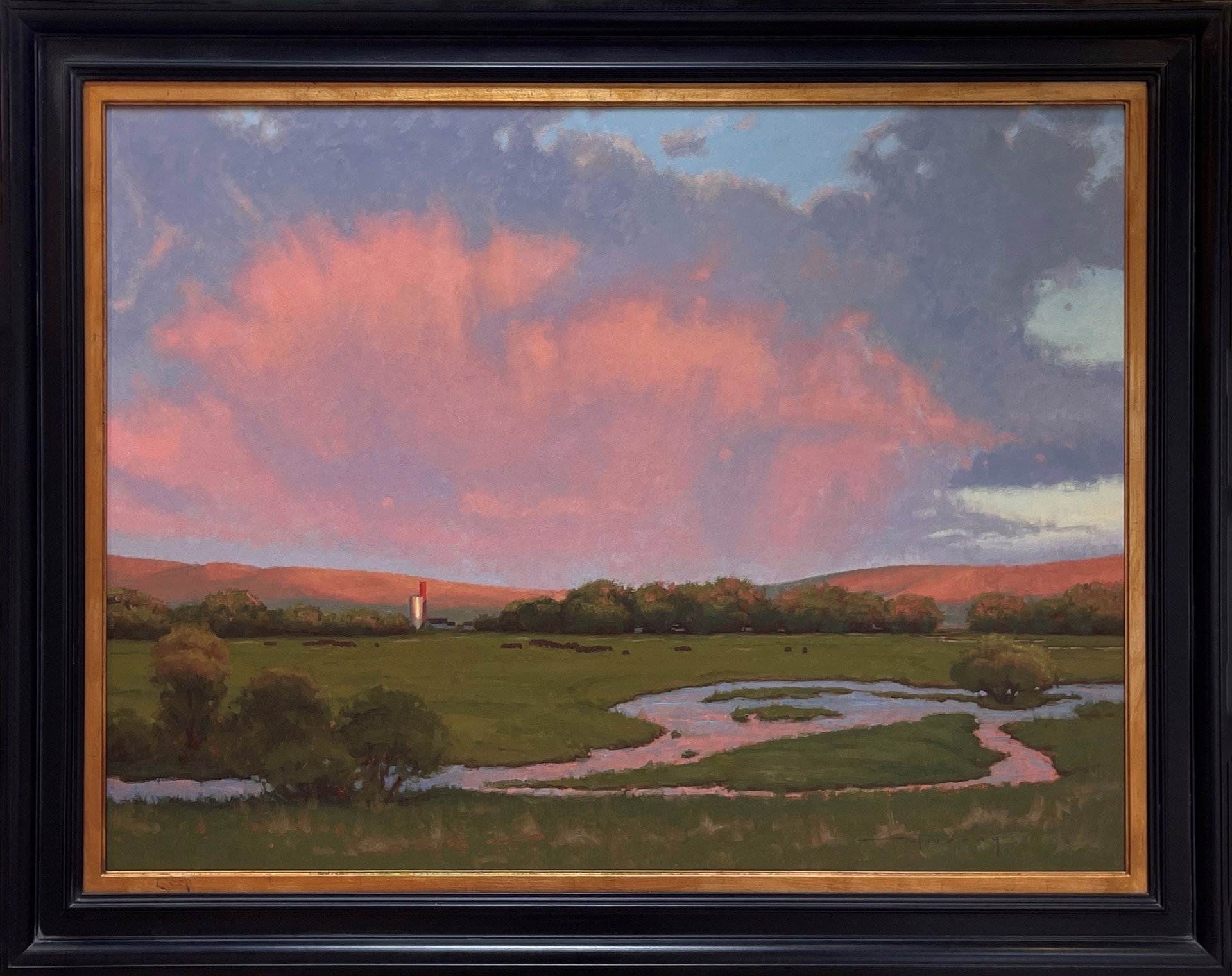 A serene landscape painting featuring a winding stream, green meadow, and dramatic pink clouds over distant hills.