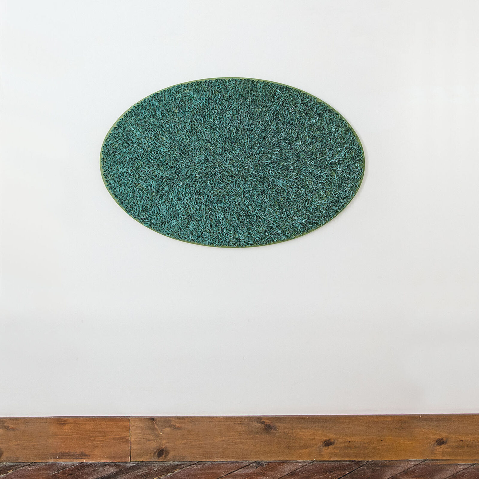 A green and black plate with a pattern on it.