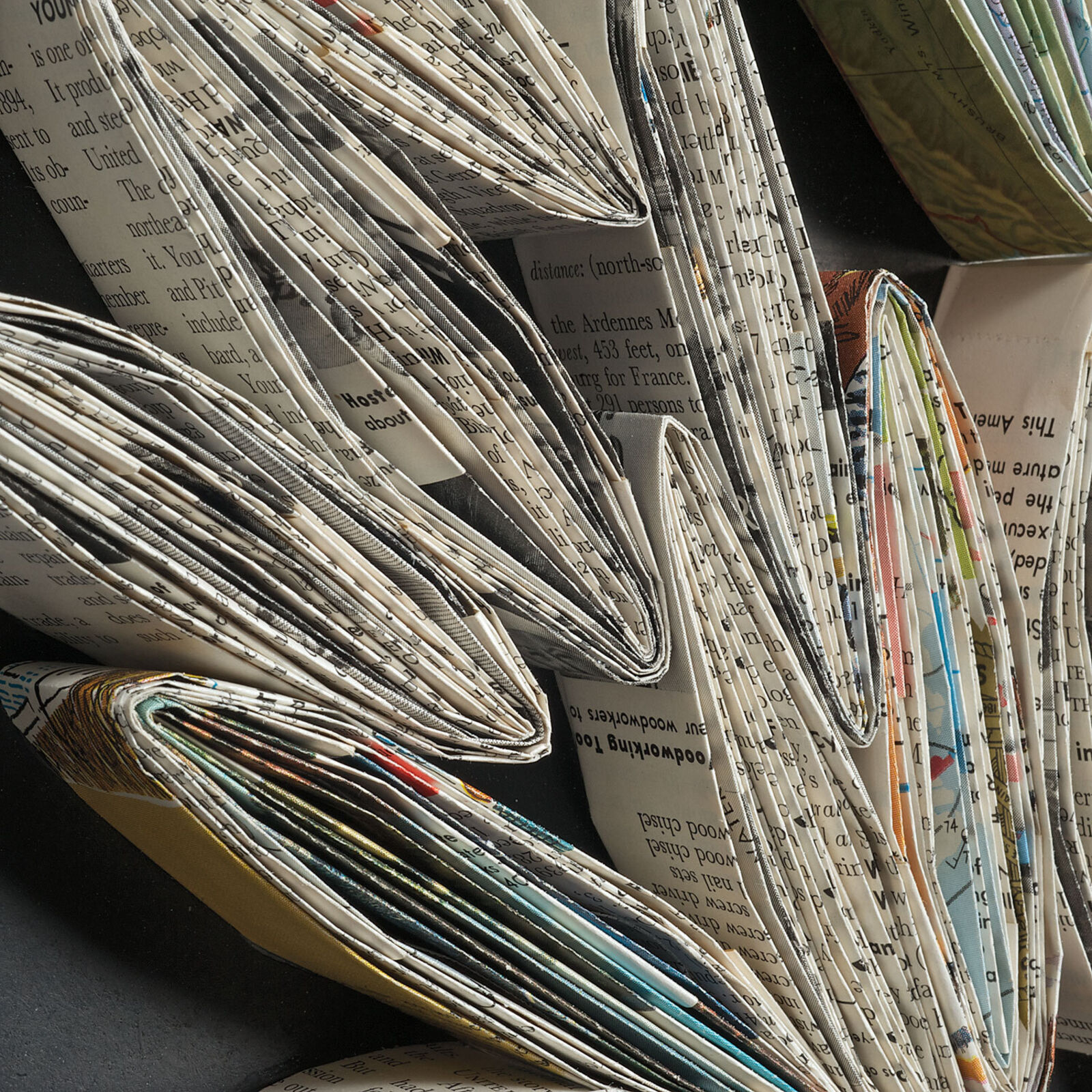 A pair of black and white wall art on a white wall.