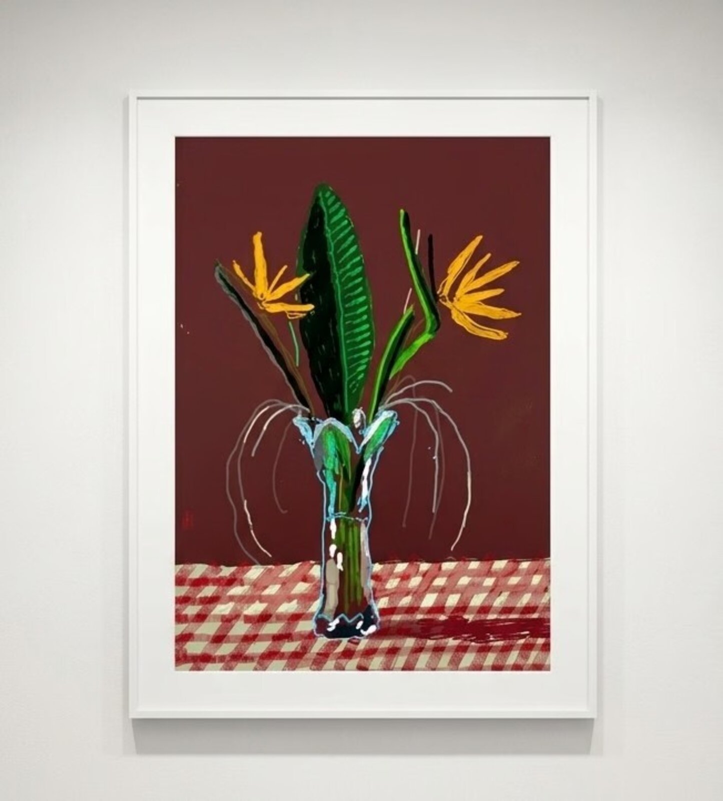 A vibrant still life of a vase with tropical flowers on a checkered tablecloth.